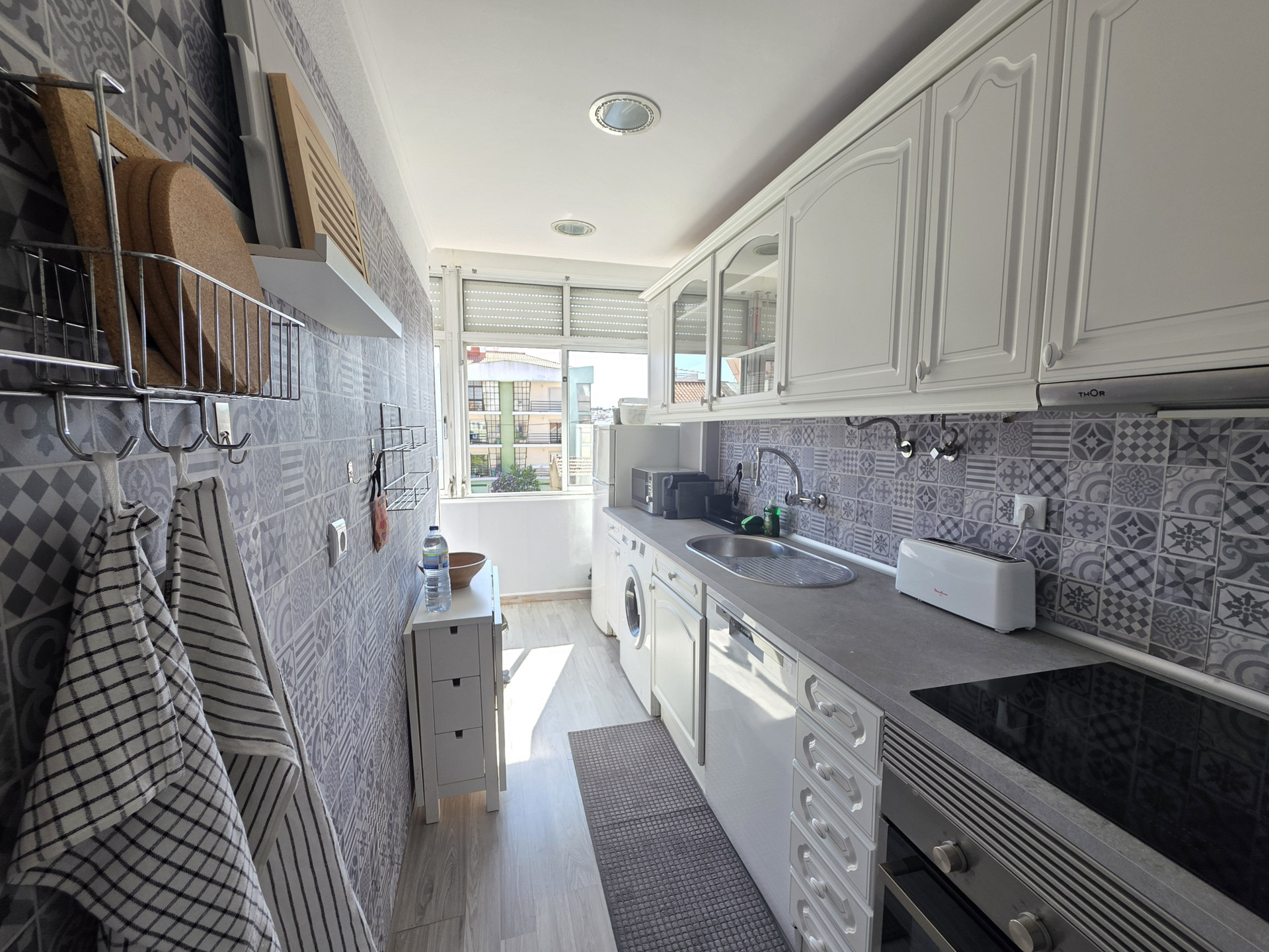 Galley kitchen with appliances