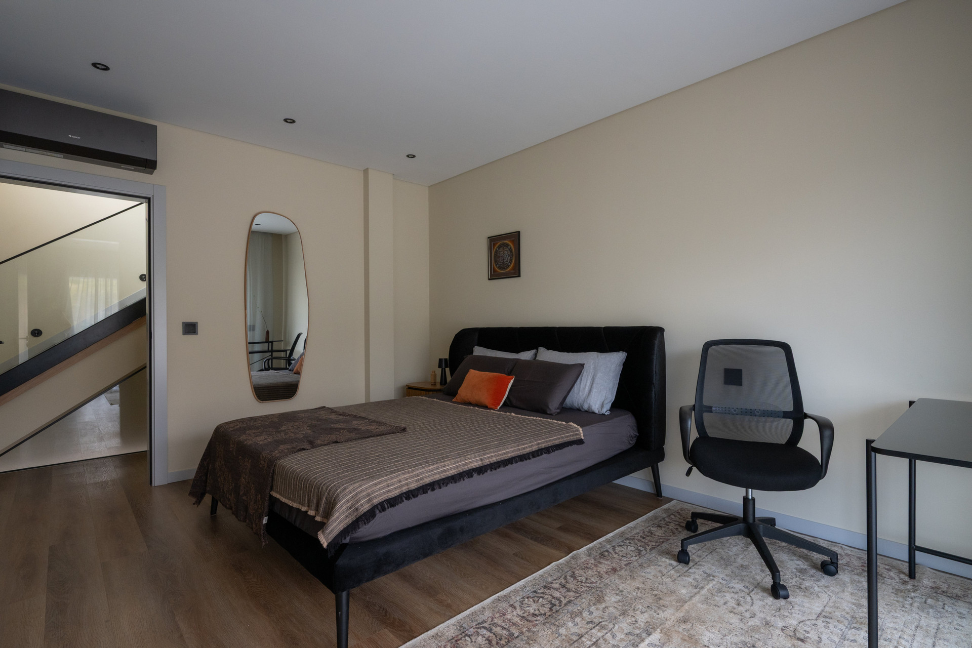 Bedroom with black leather bed