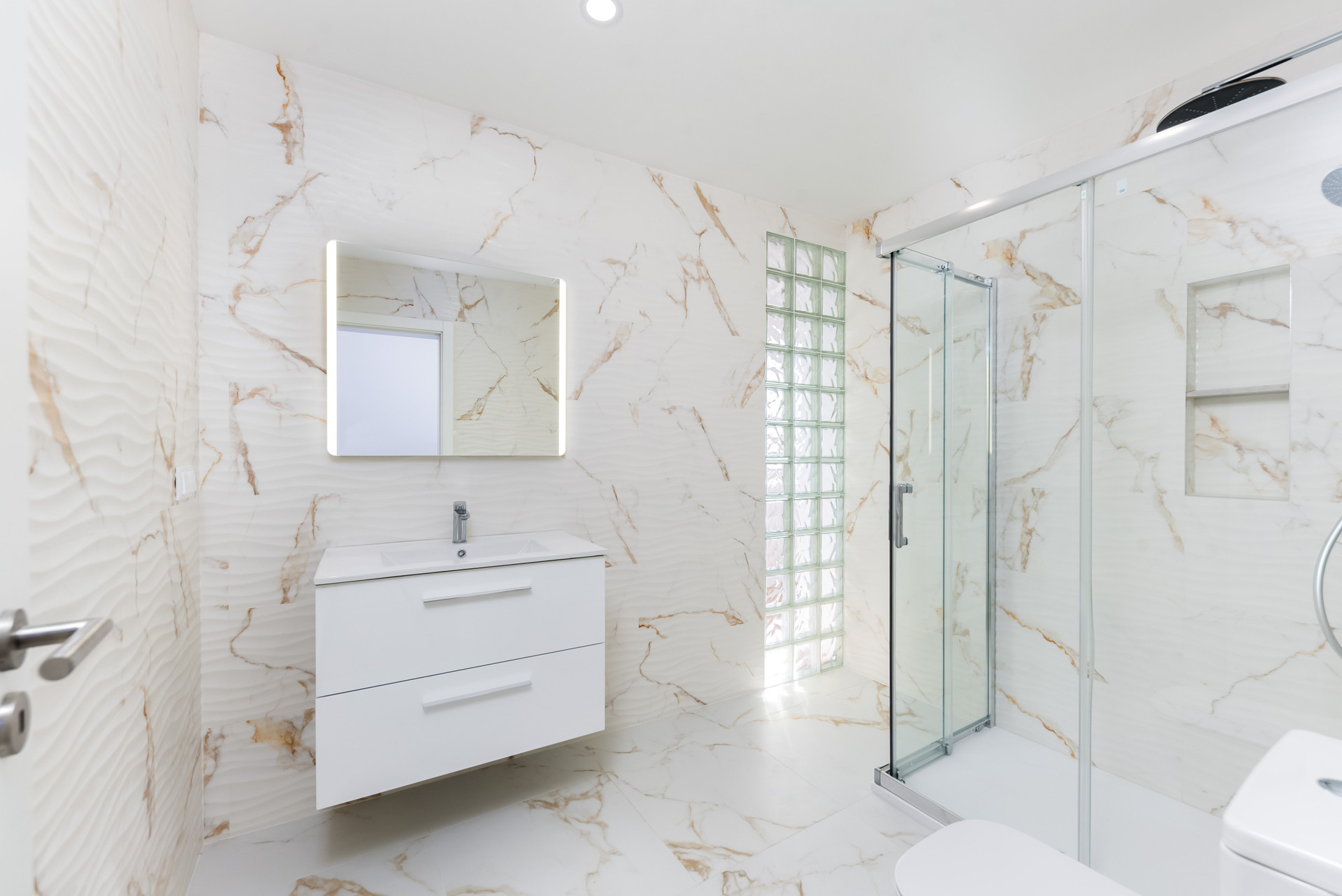 Marble bathroom with glass shower