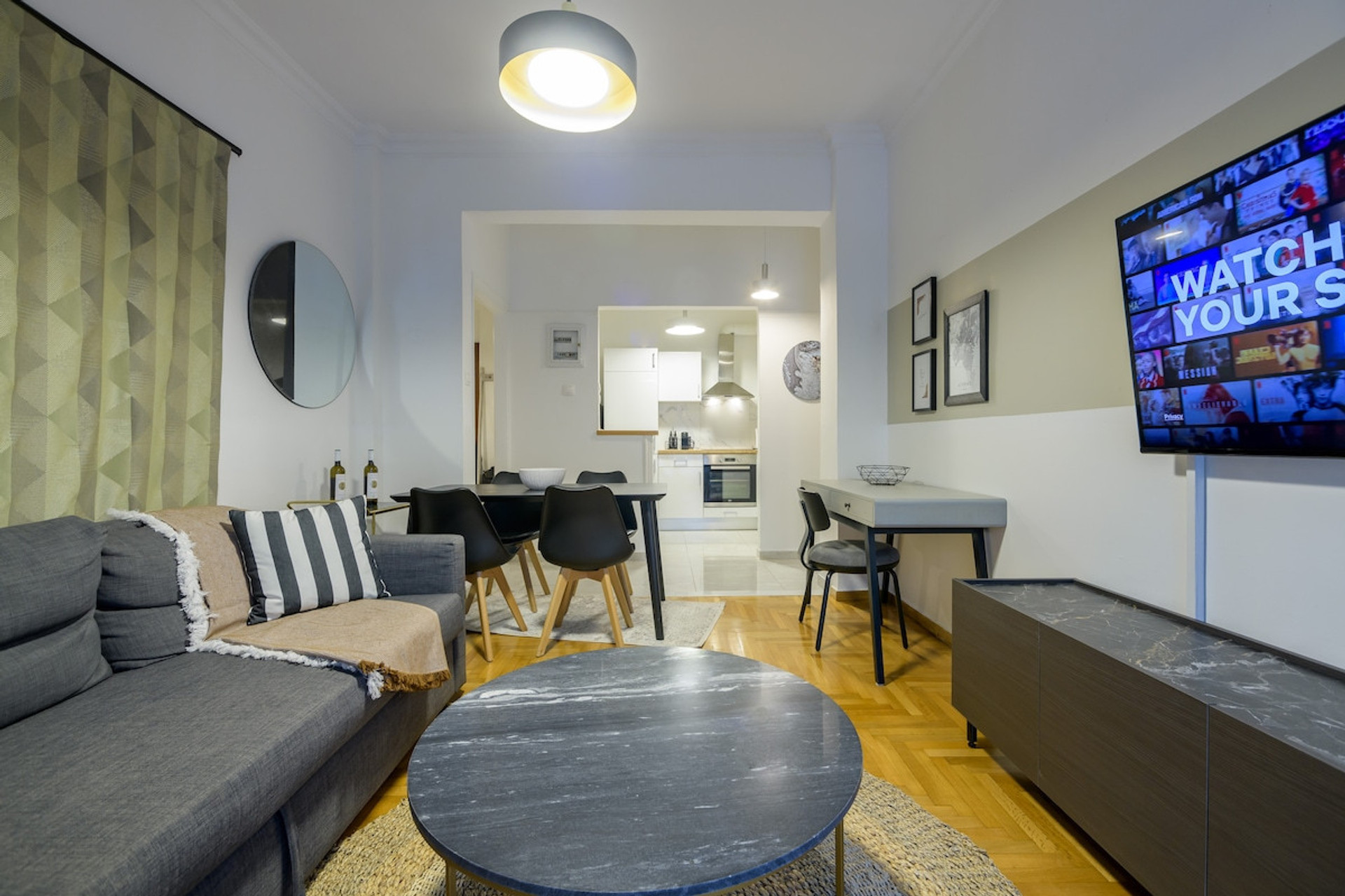 Experience comfort and elegance in this inviting living room, featuring a plush sofa and stylish furnishings. Enjoy leisure time with a state-of-the-art smart TV, perfect for relaxation or entertaining guests. Ideal for cosy evenings in.