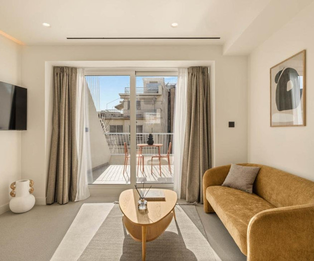 Living room with balcony views