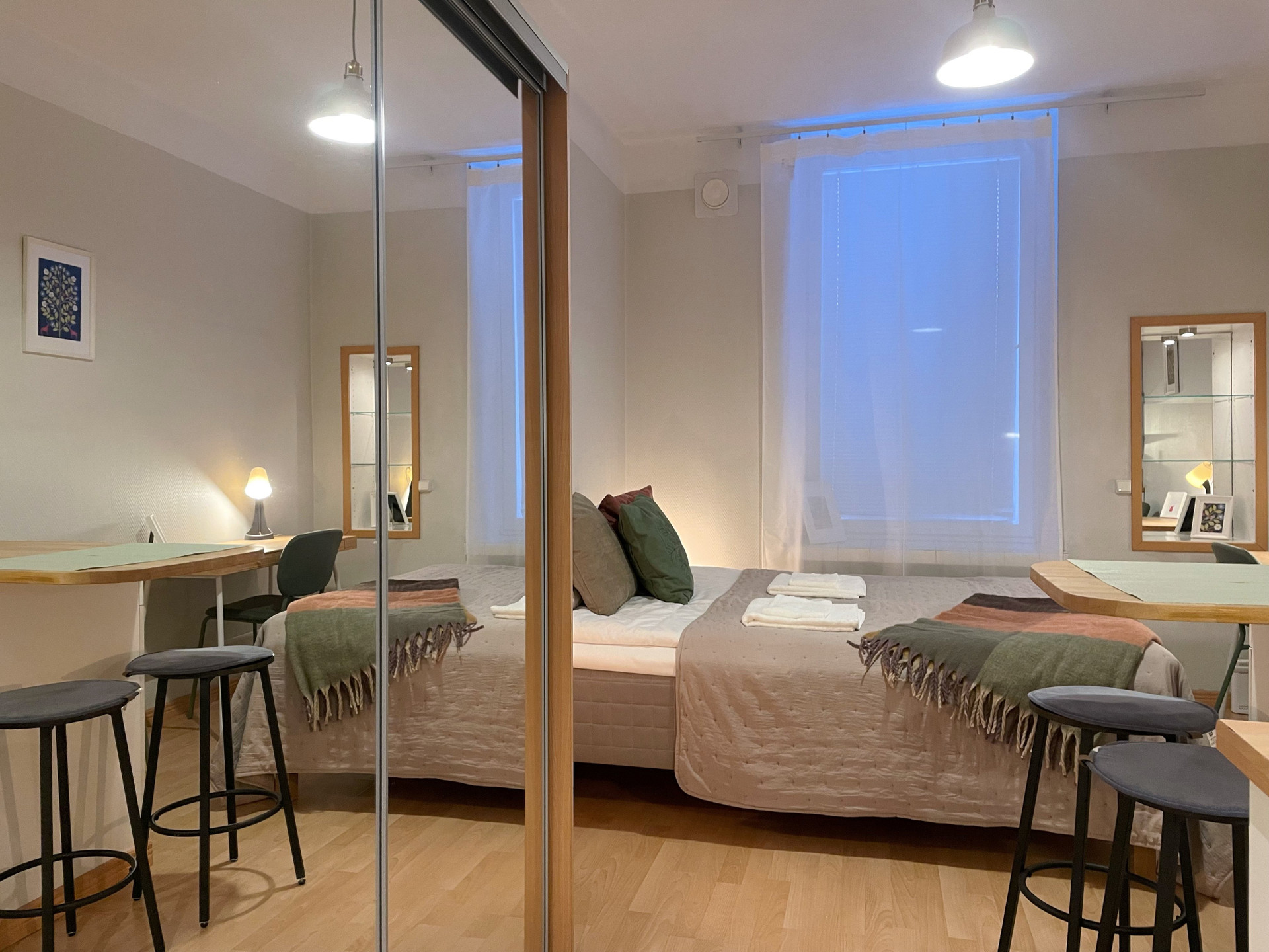 Bright studio with mirrored wardrobe