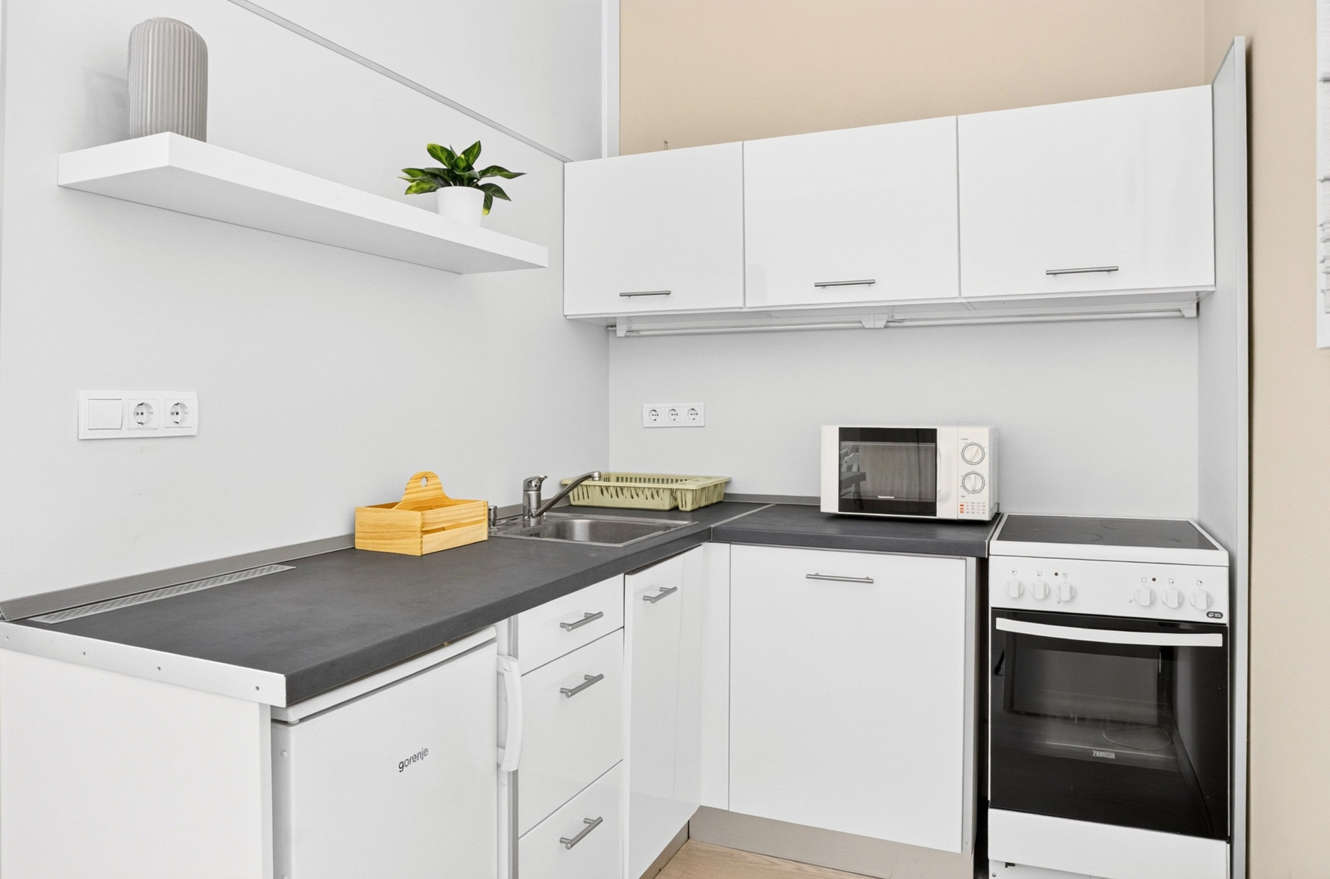White kitchen with sink stove cabinets
