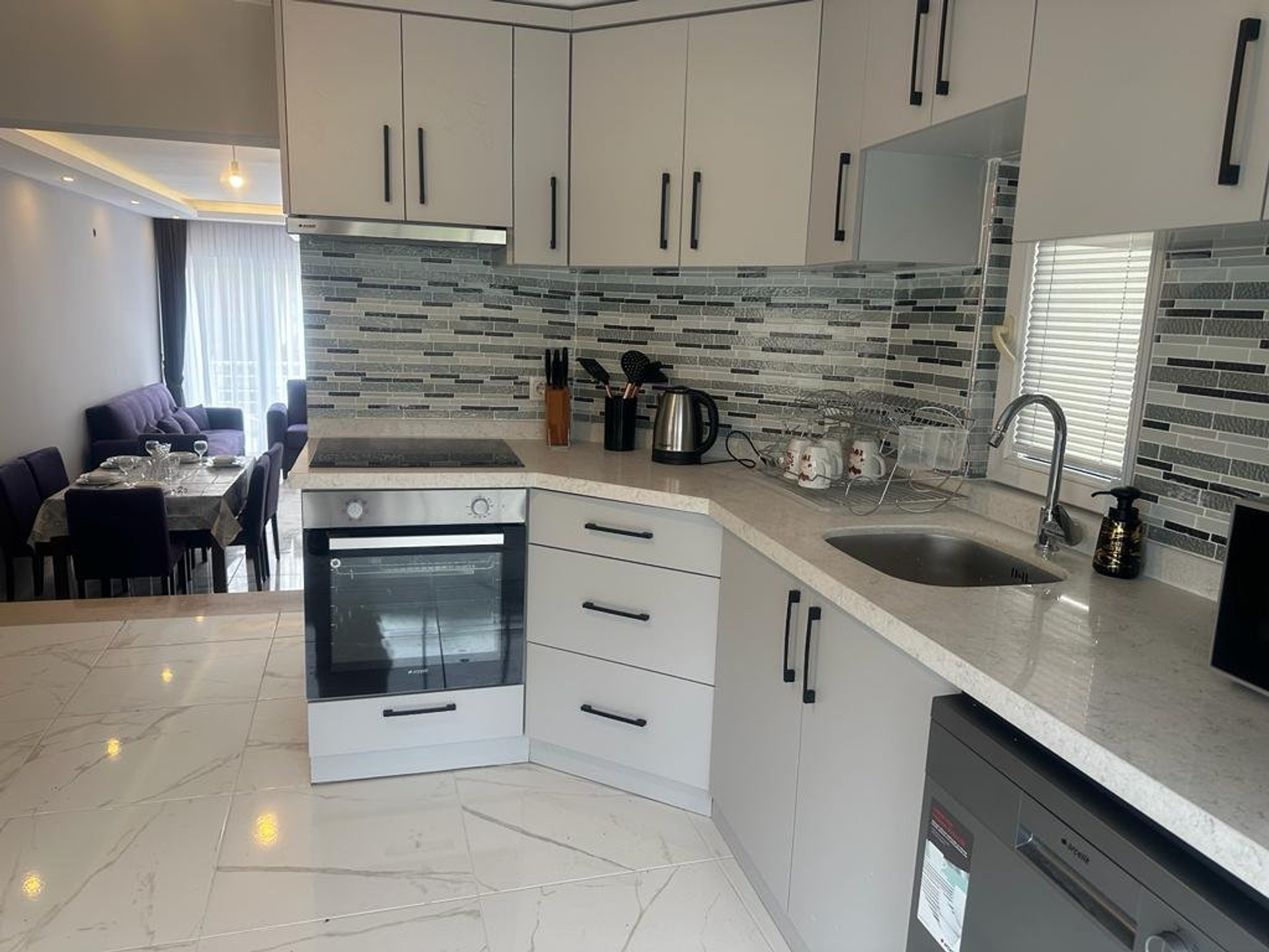 Modern kitchen with open living area