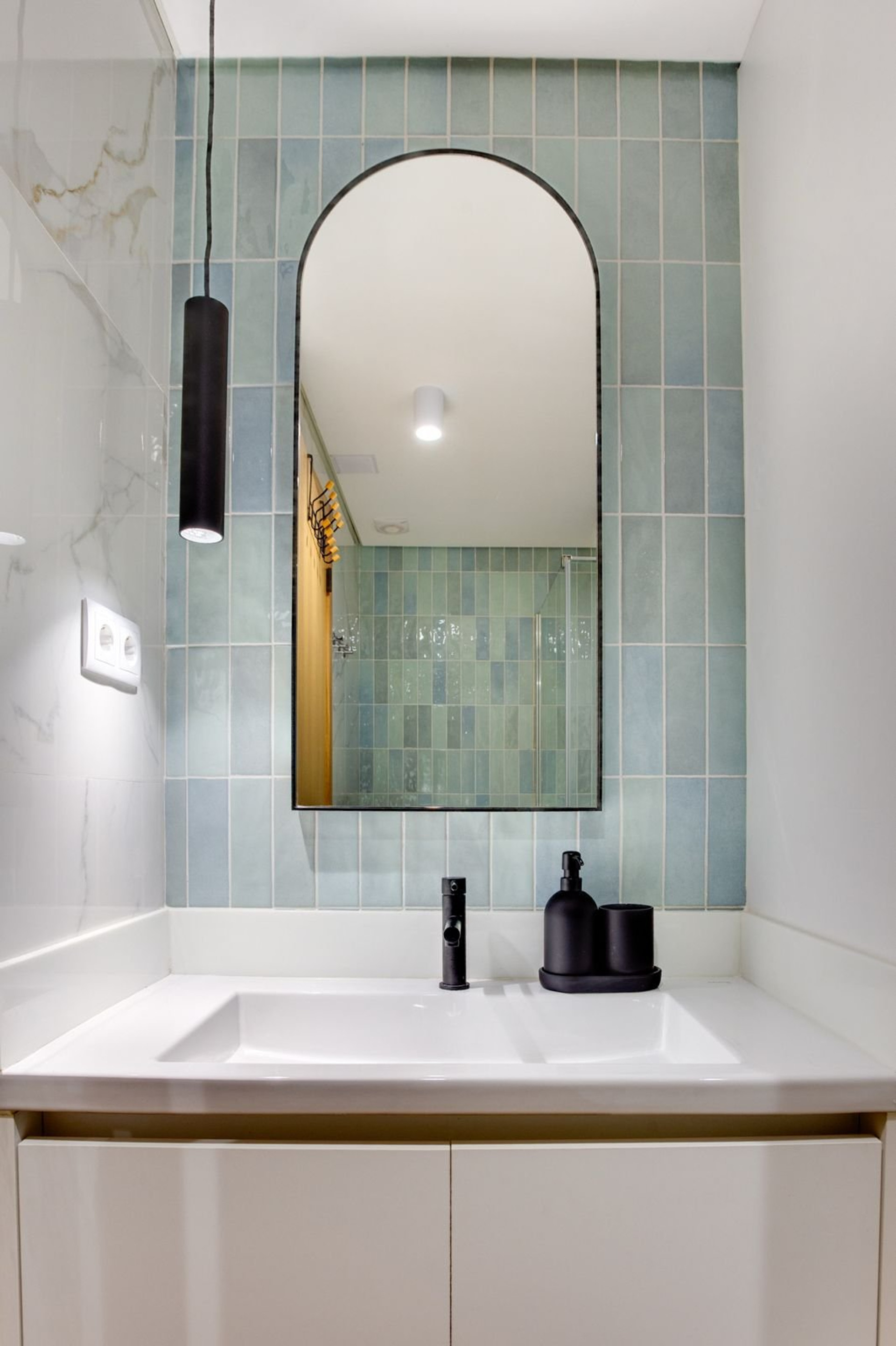 Bathroom vanity with arched mirror