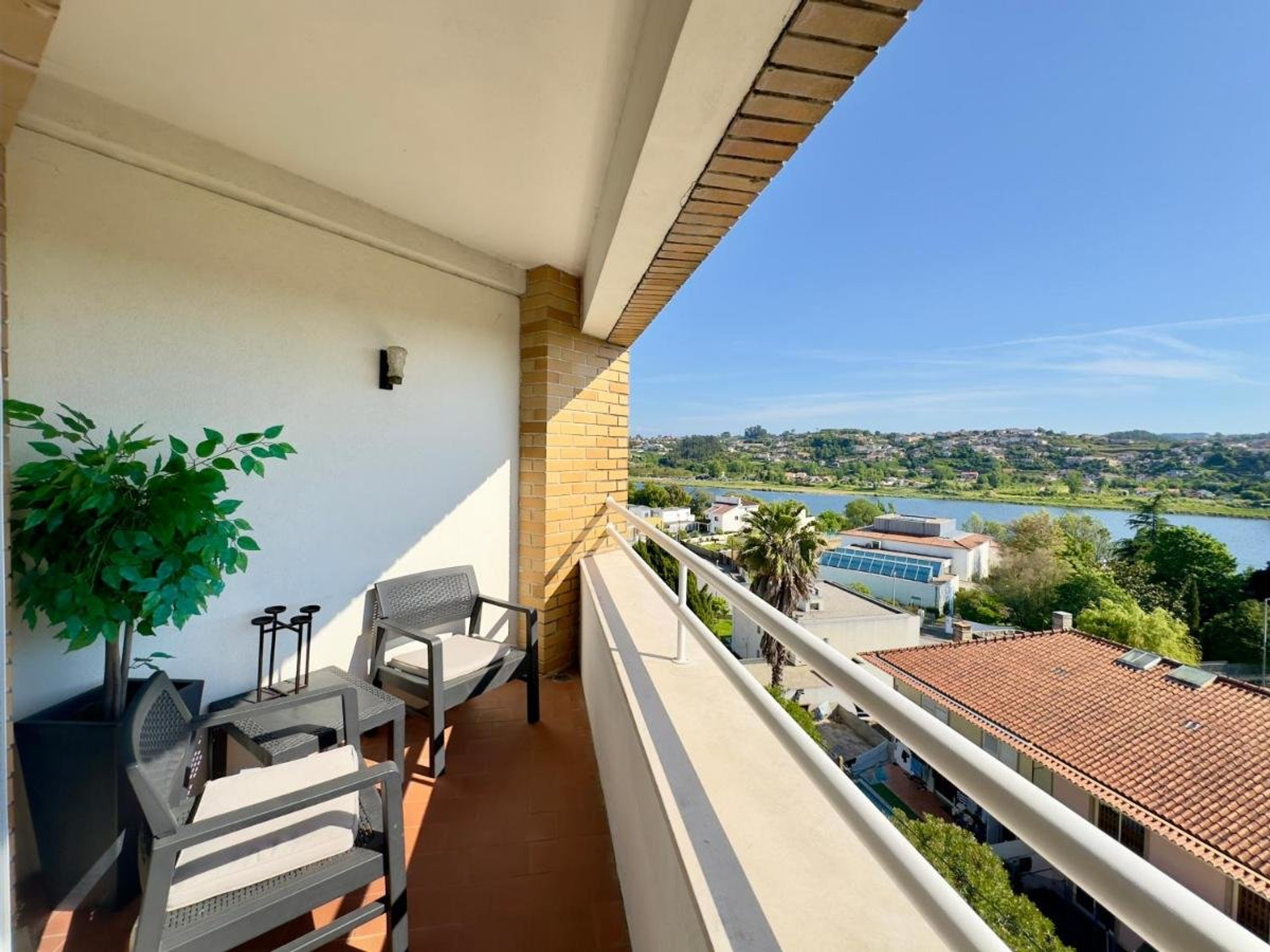 Balcony with river view seating