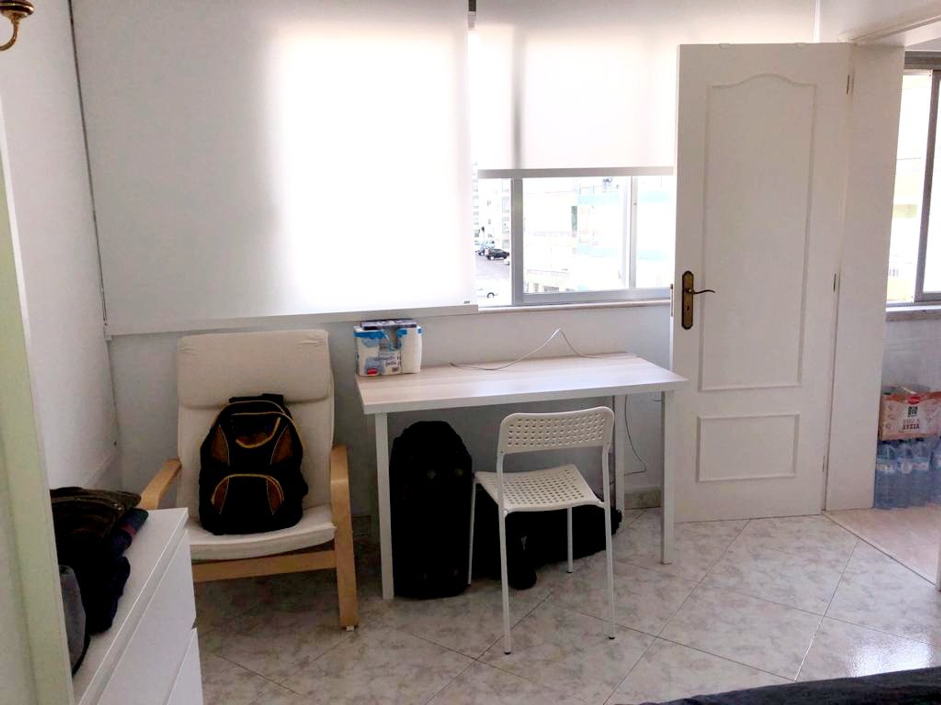 Bedroom with desk and door