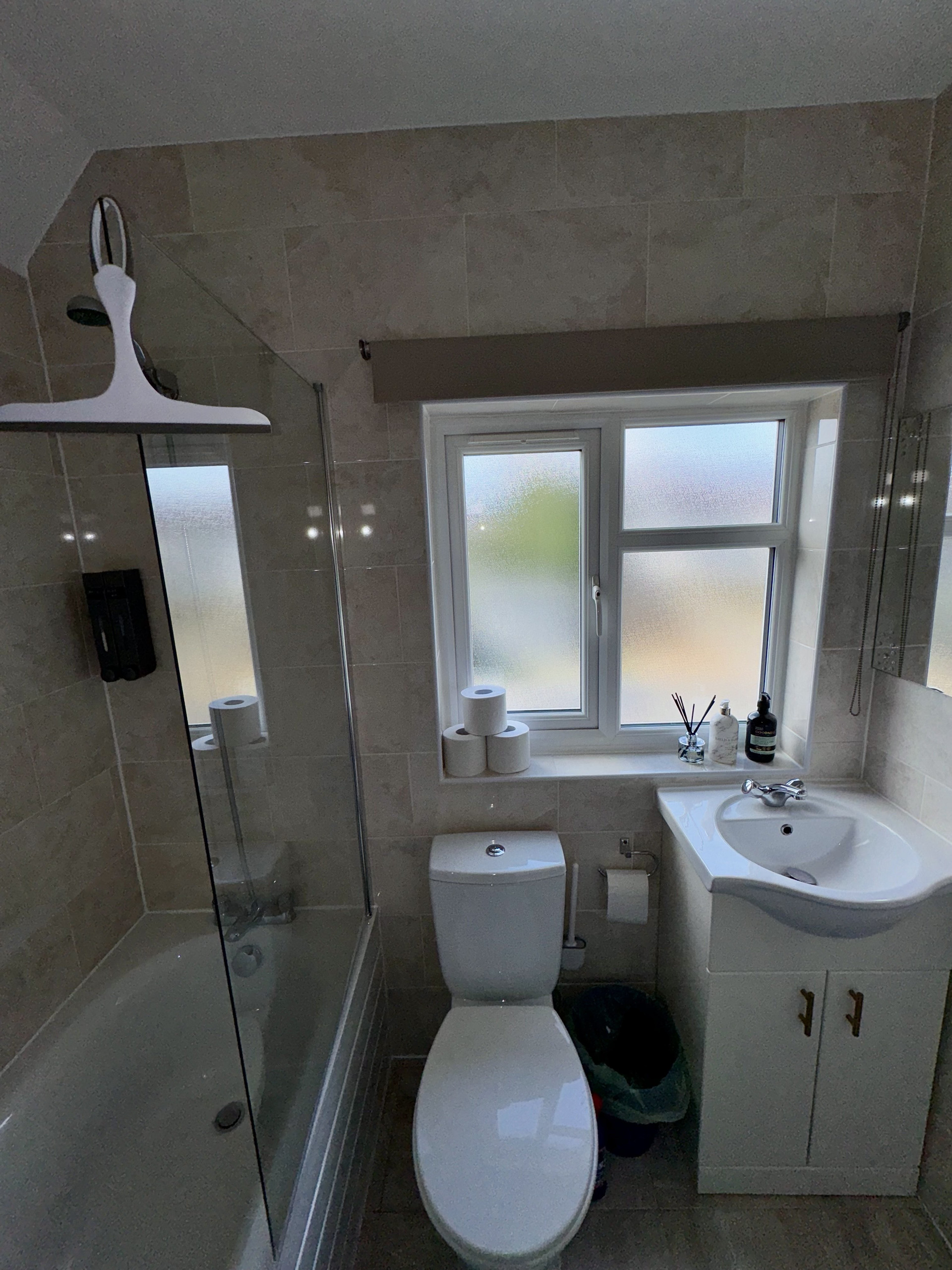Full bathroom with tub and toilet