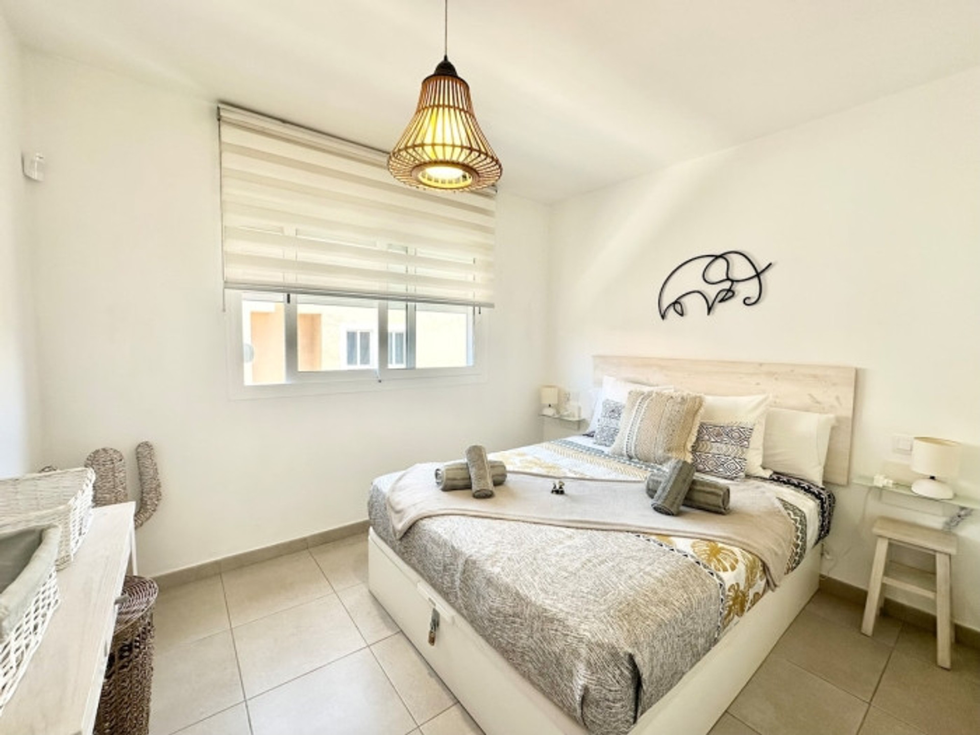 Bright bedroom with double bed