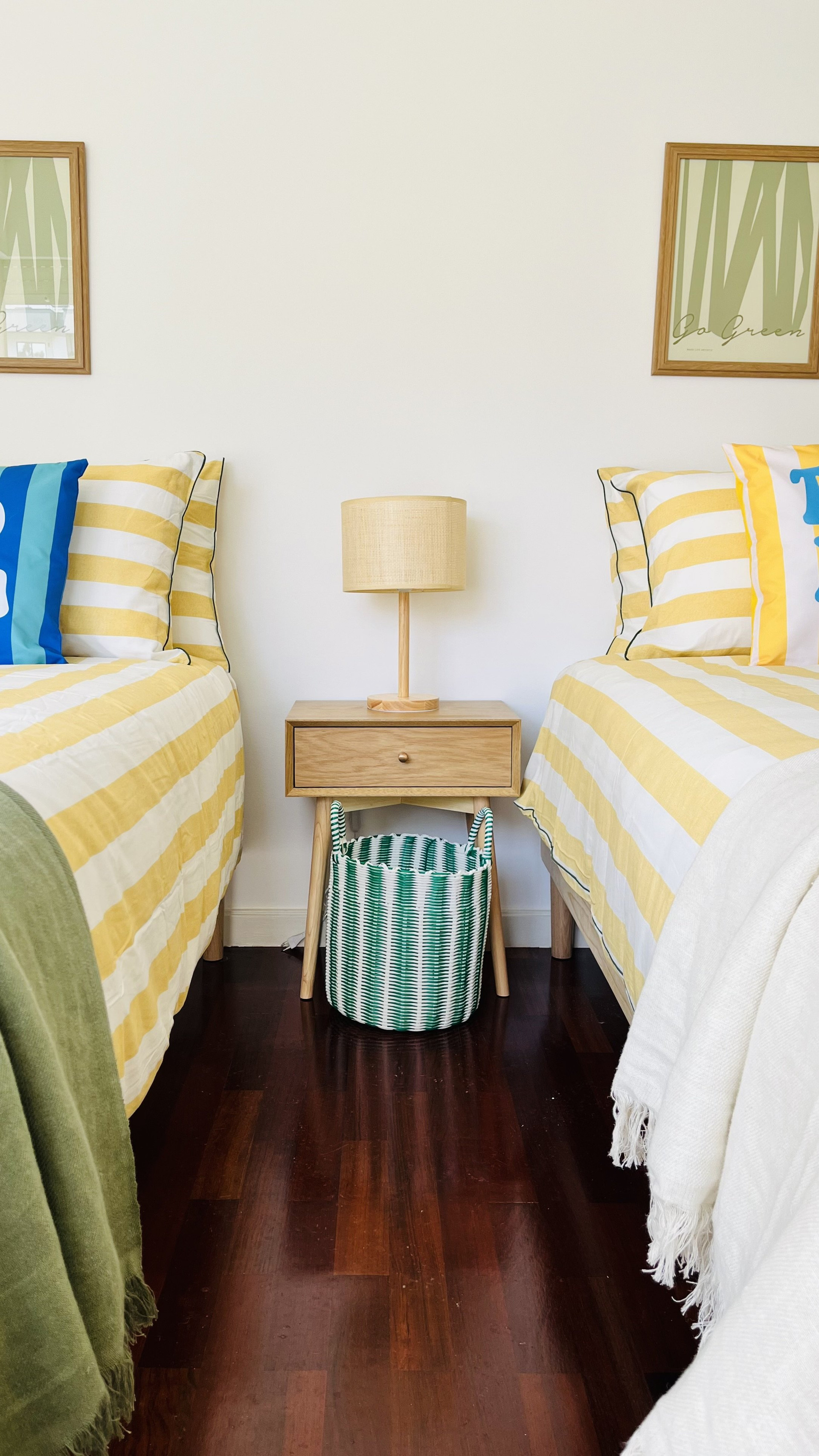 Twin beds with shared nightstand