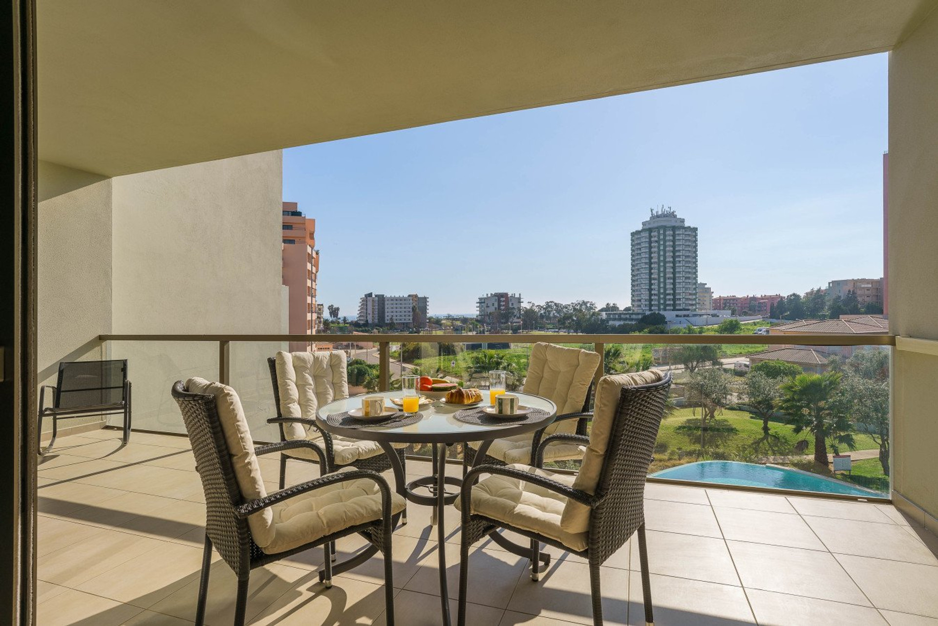 Balcony dining area with skyline view