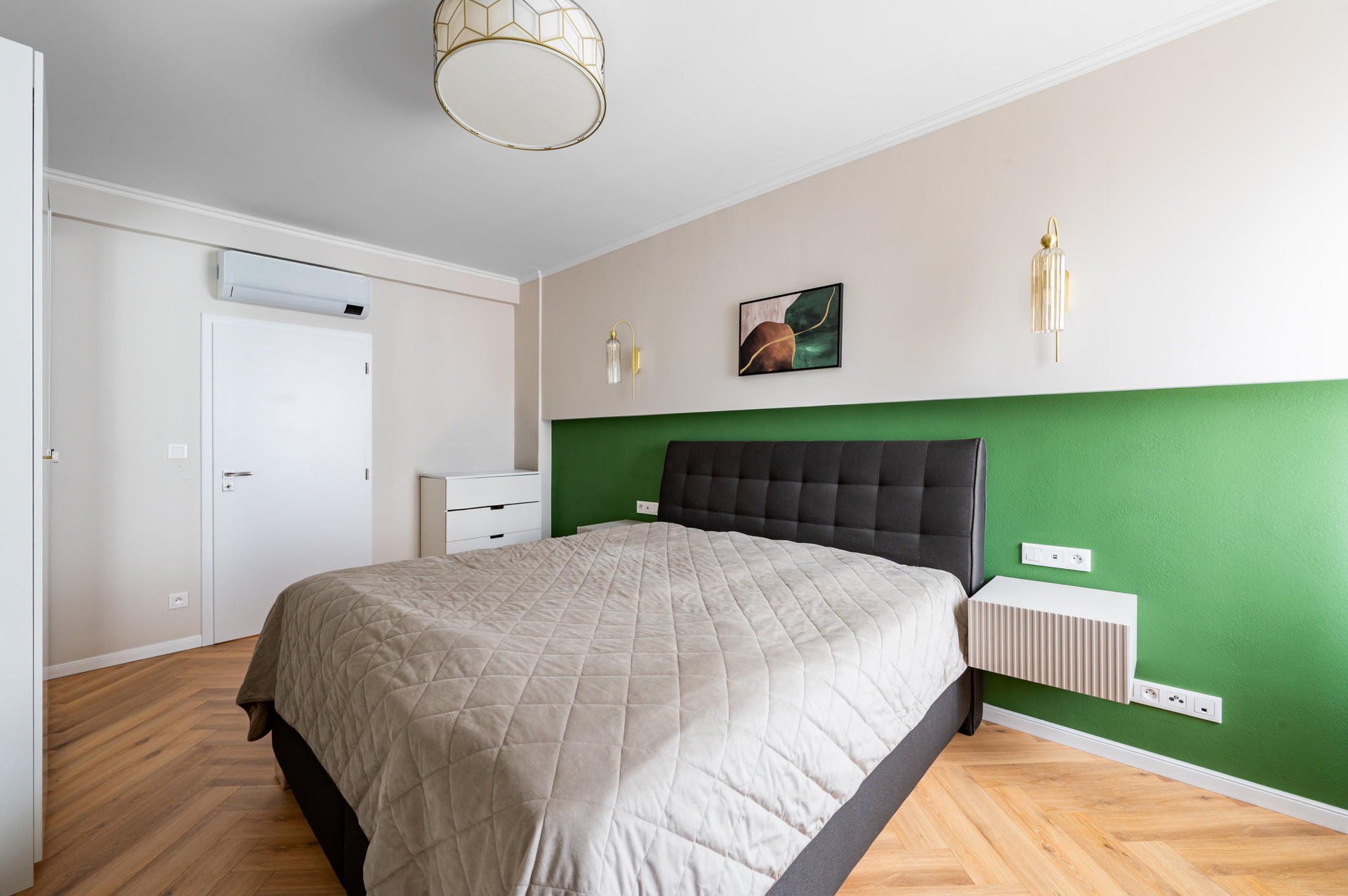 Bedroom with green accent wall