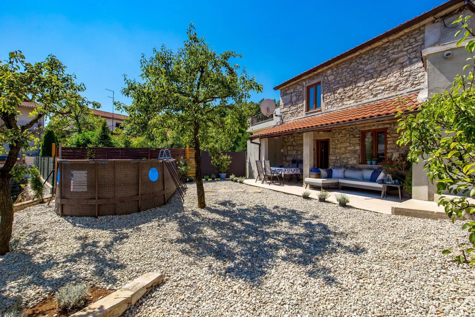 Stone house exterior with pool garden