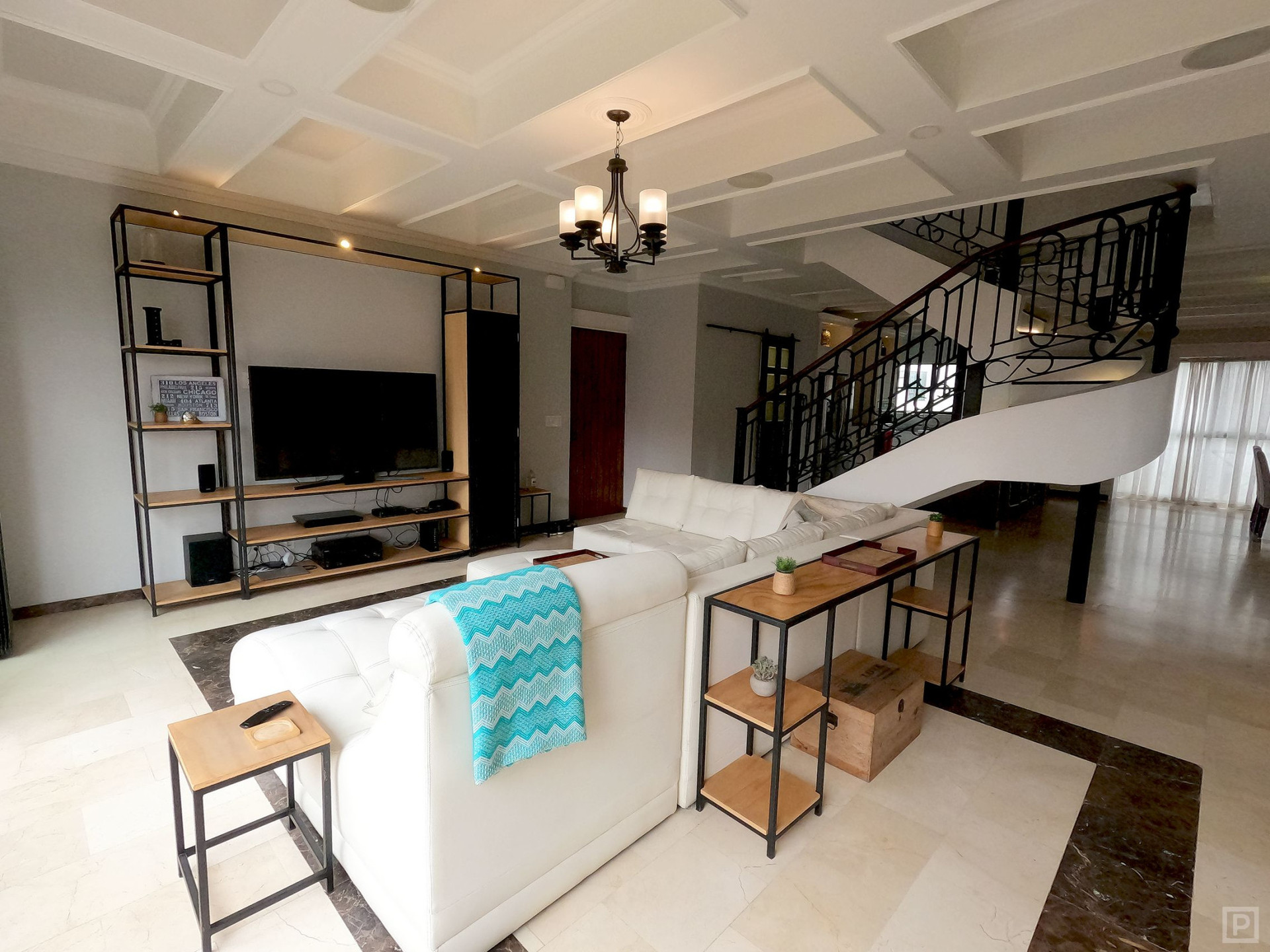 Main living room has wall-to-wall view windows, 65" 4k smart TV, surround sound home theater & more!