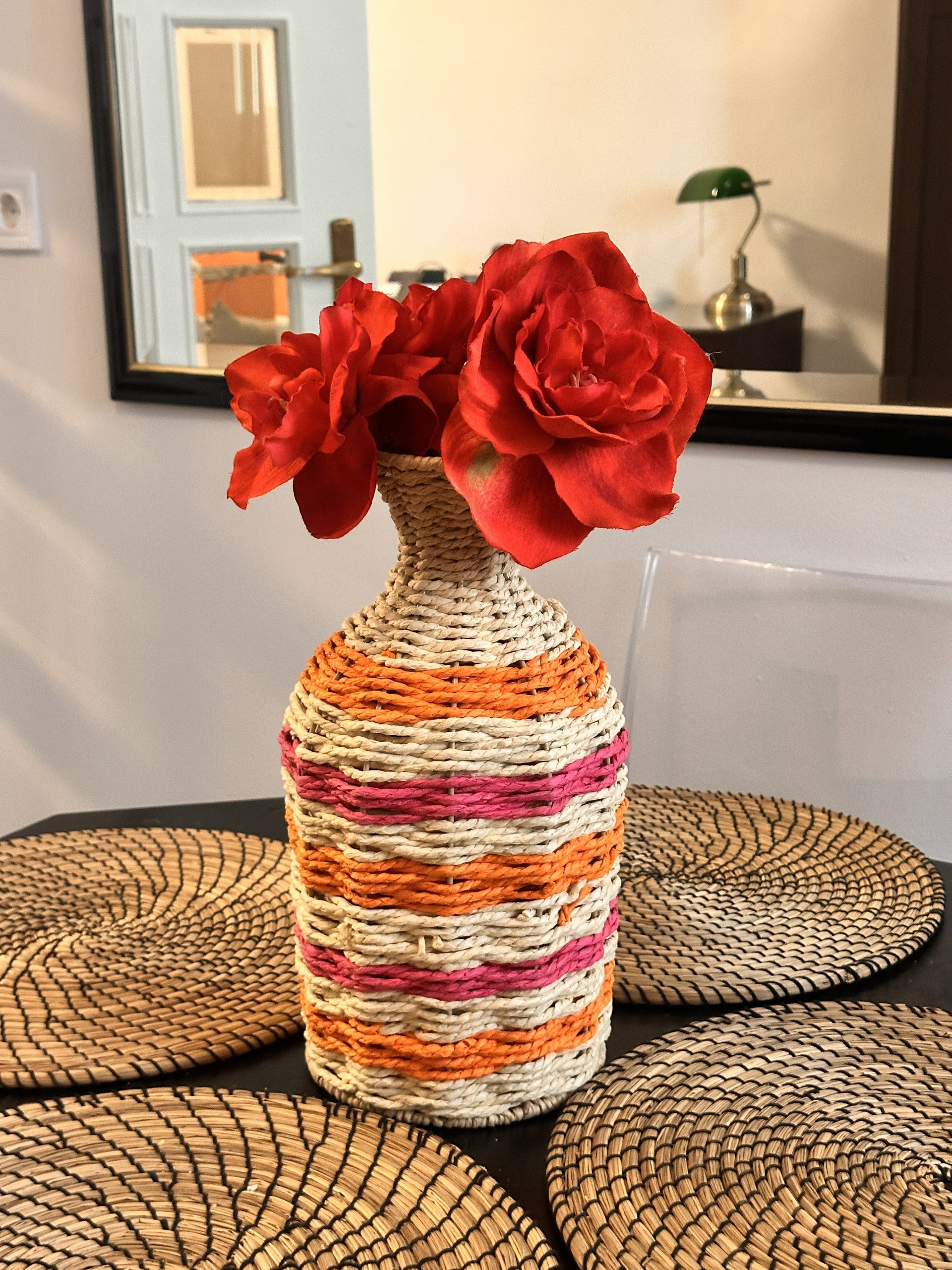 Decorative vase with red flowers