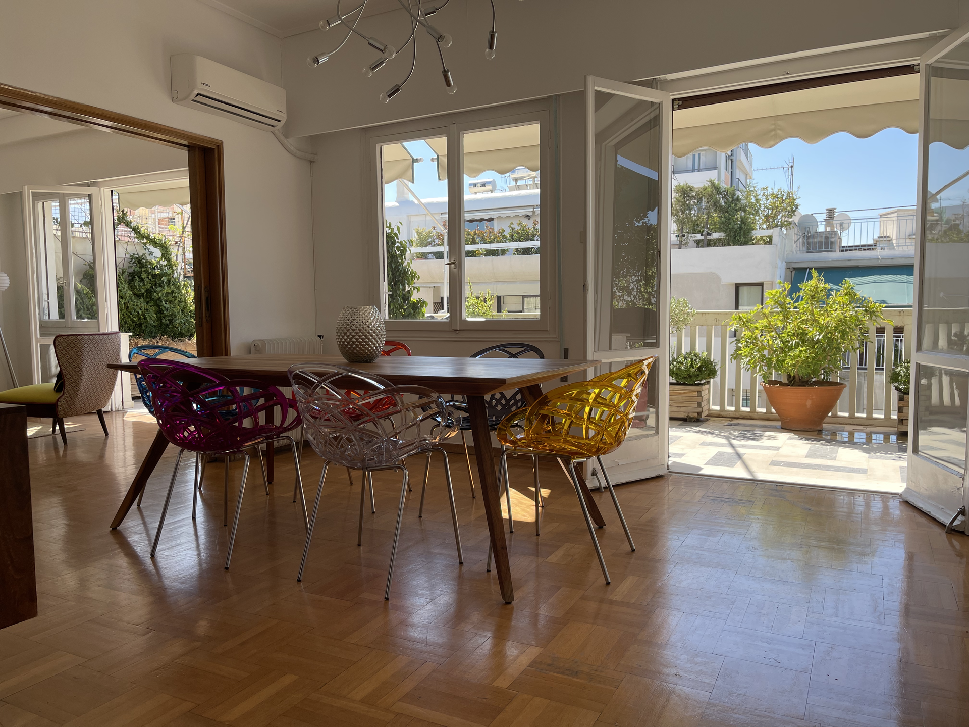 Bright dining area colorful chairs