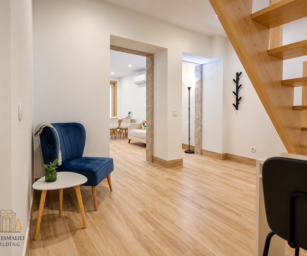 Hallway with blue armchair