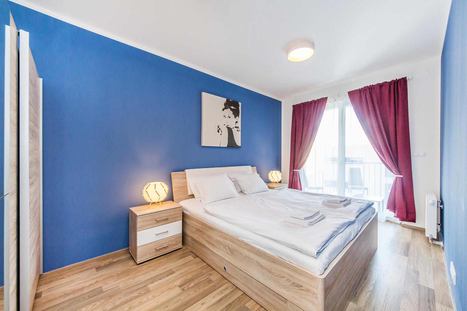 bedroom with double bed and entrance to terrace