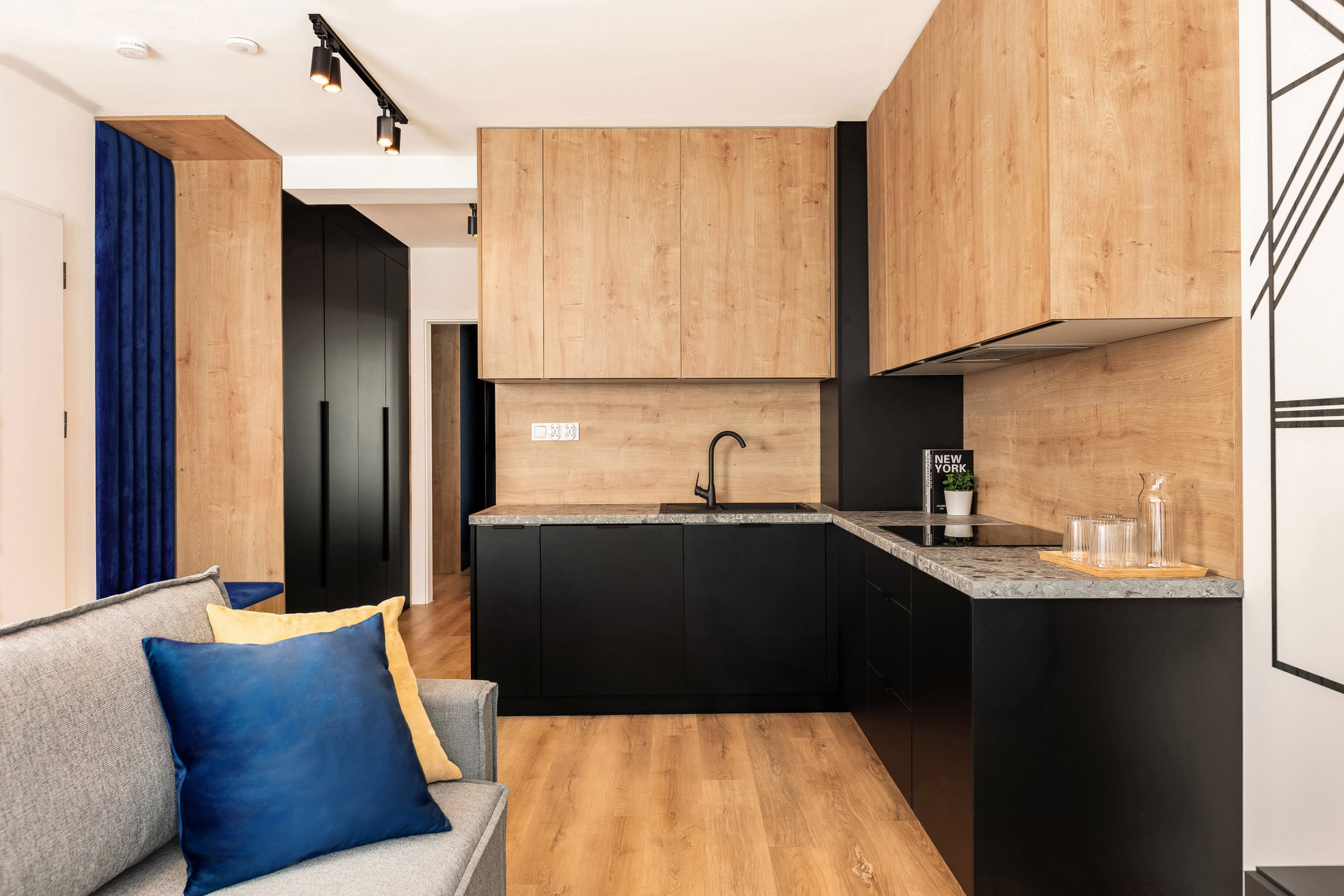 Kitchen with black and wood cabinets