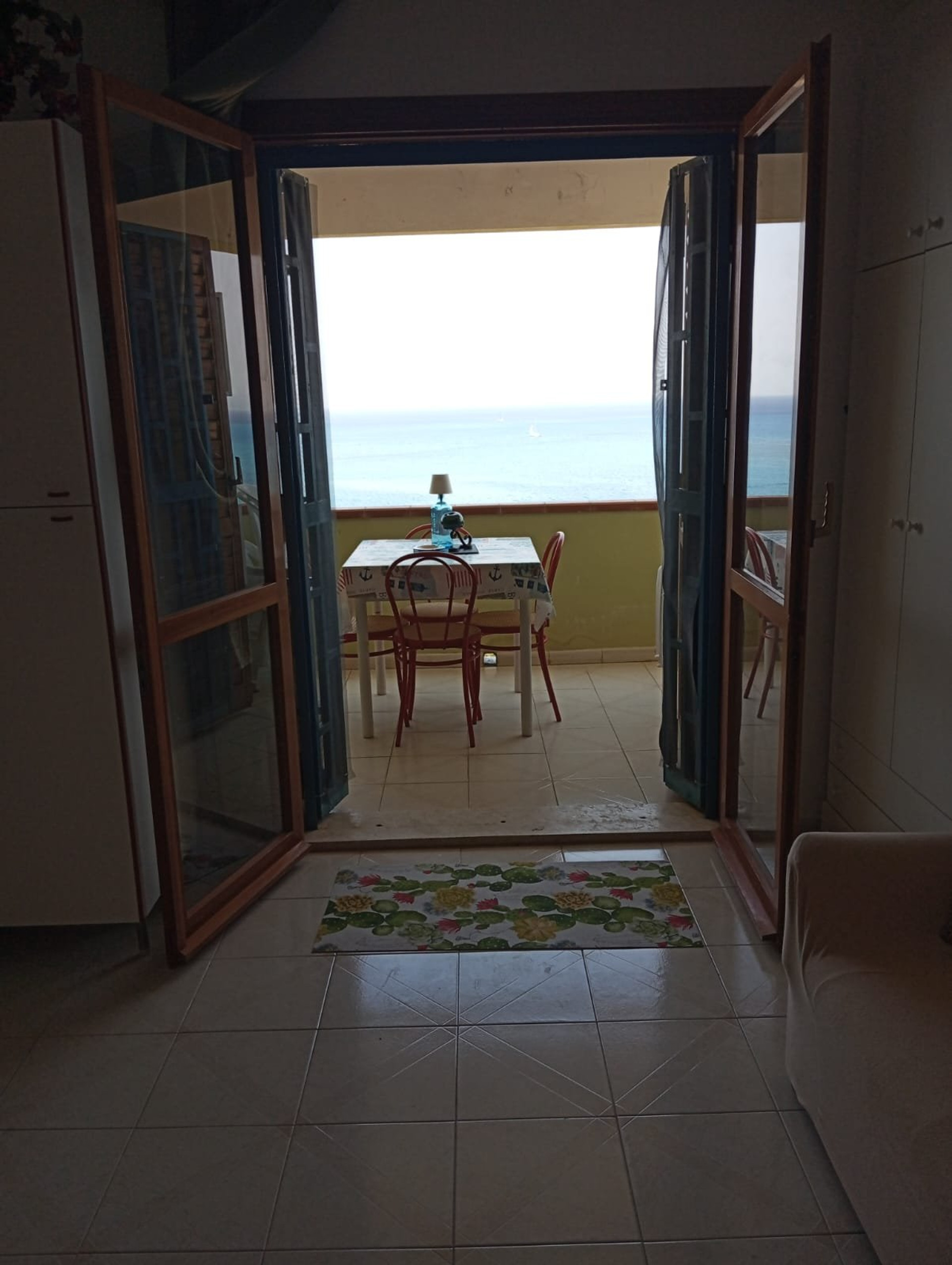 Balcony doors opening to sea view