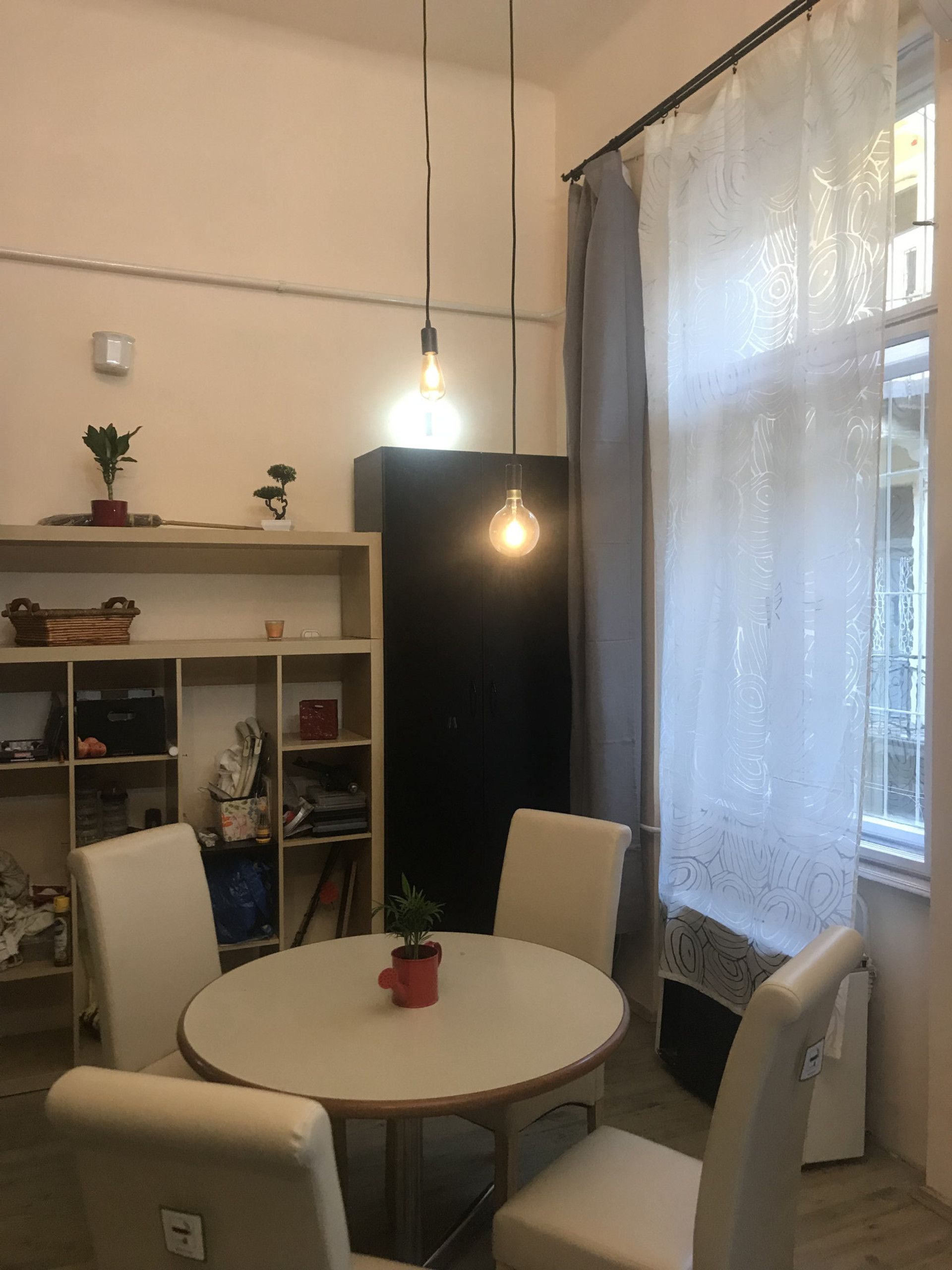 Dining table with window and wardrobe