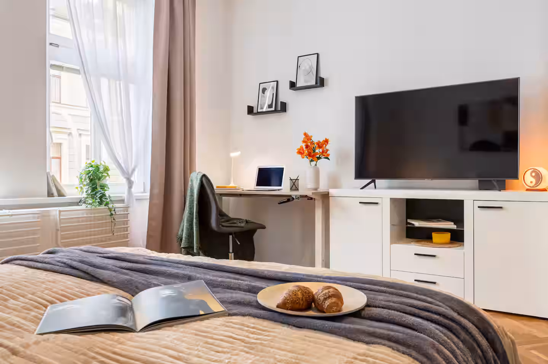 Bedroom with TV and desk
