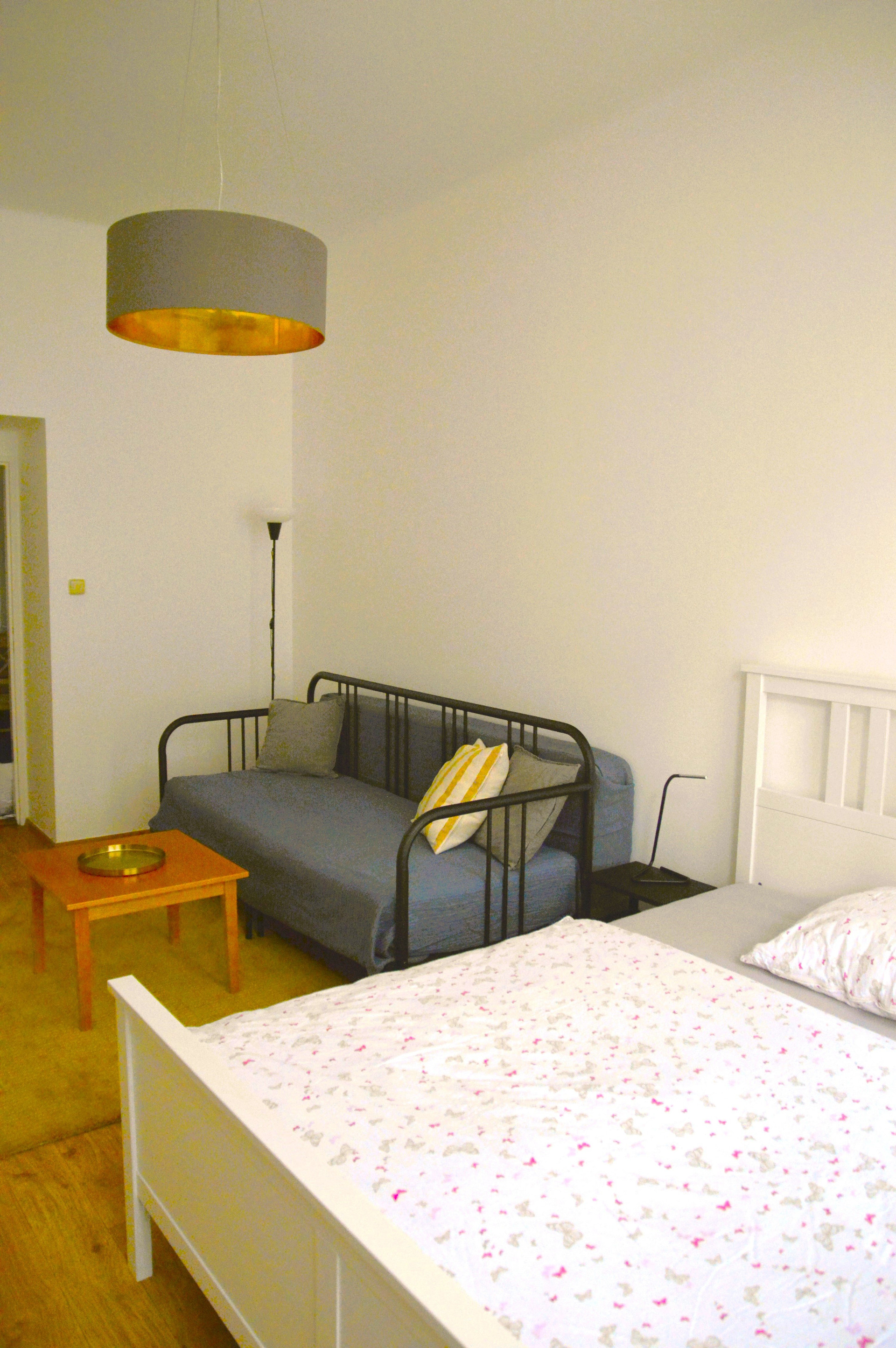 Bed and sofa corner view