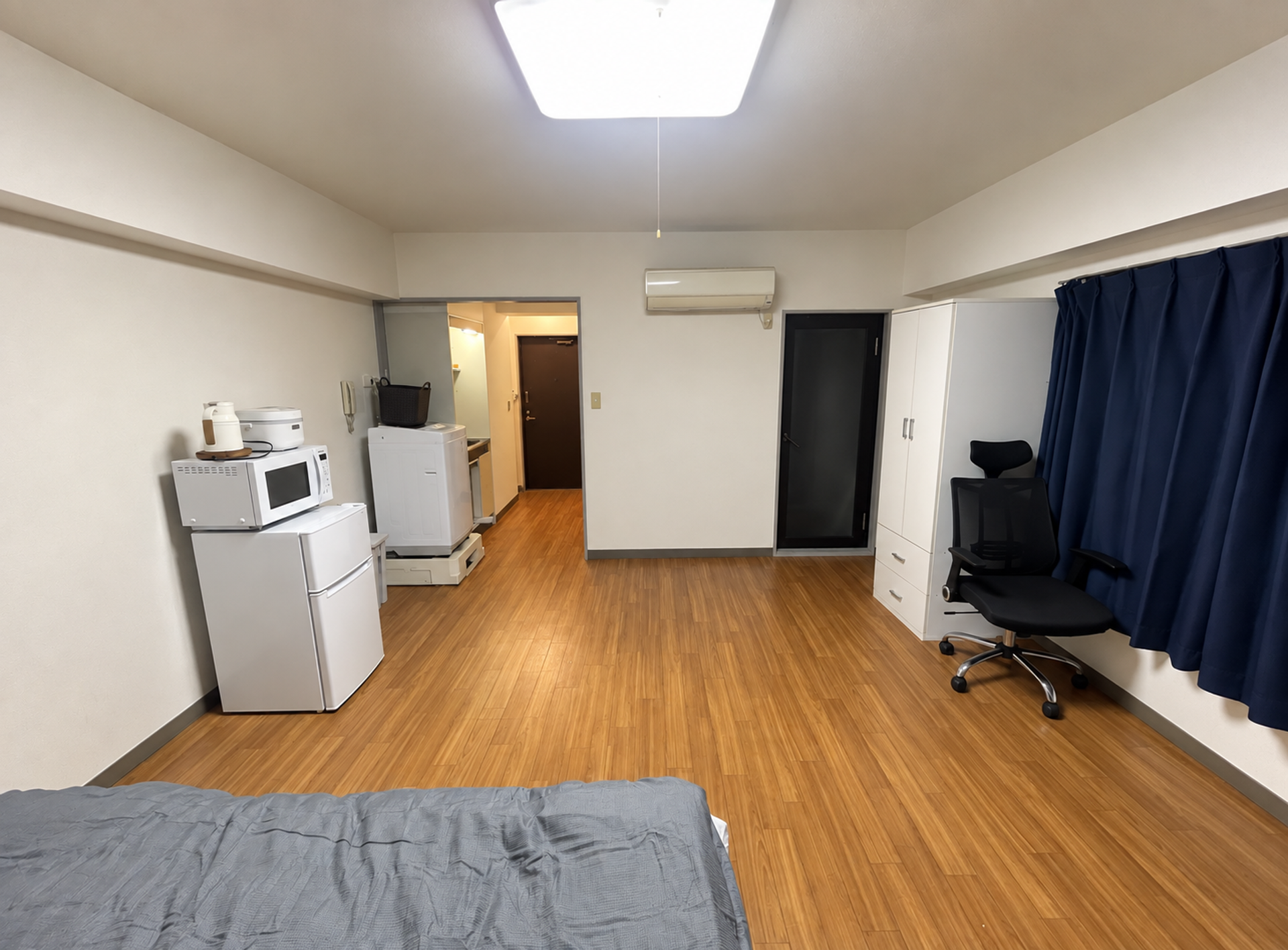 Studio view toward entry and wardrobe