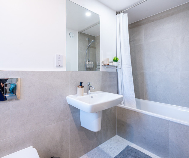 Bathroom with bathtub and sink