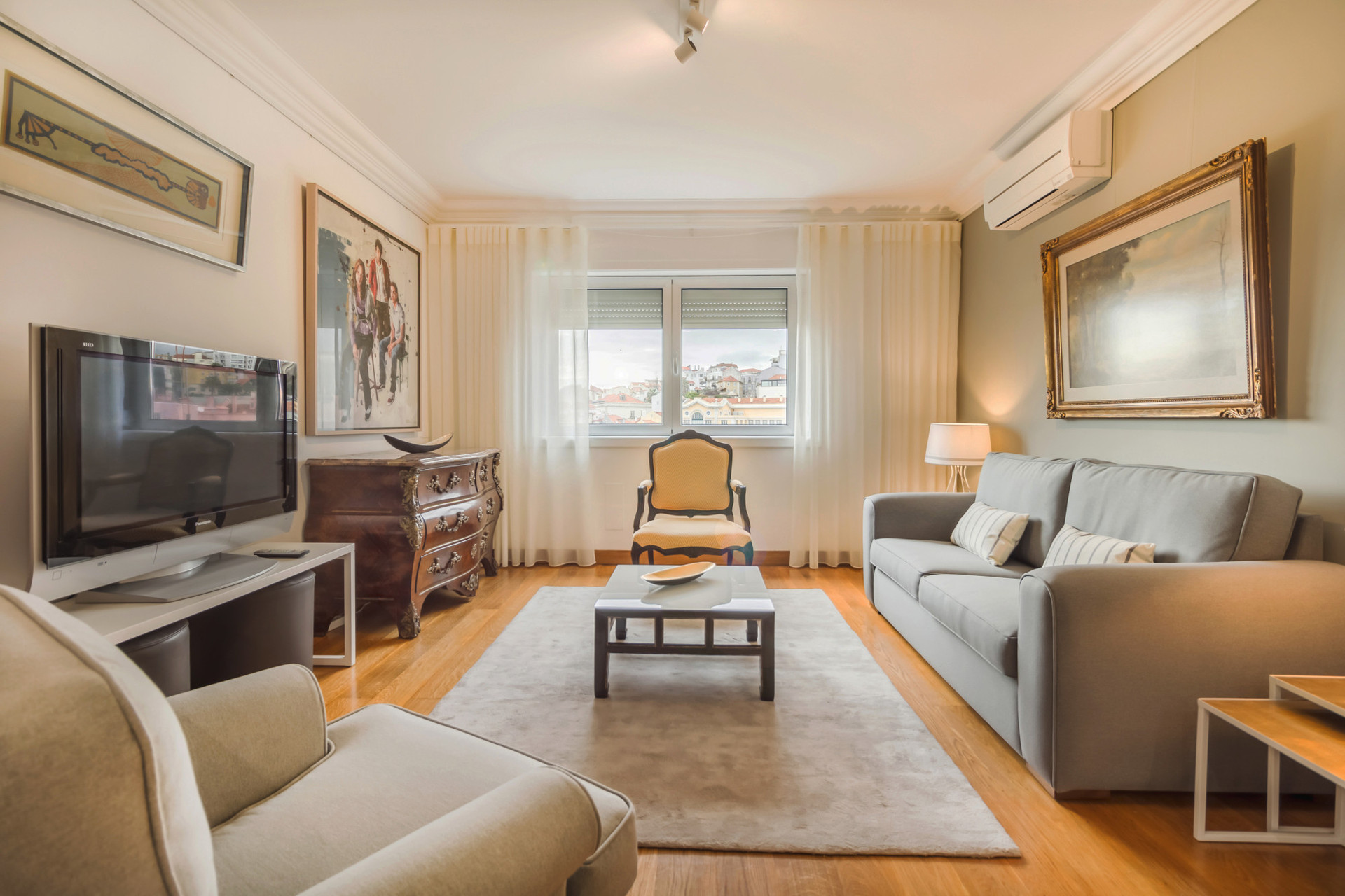 Living Room with TV, Sofa and Dining Table