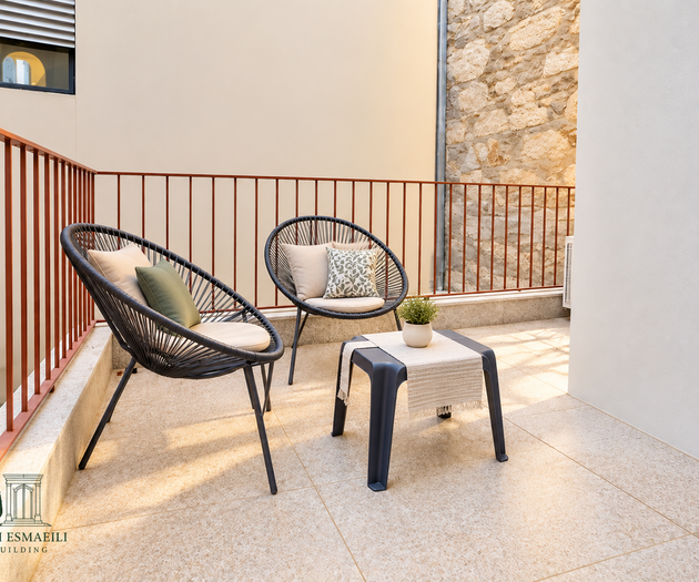 Terrace with cushioned chairs