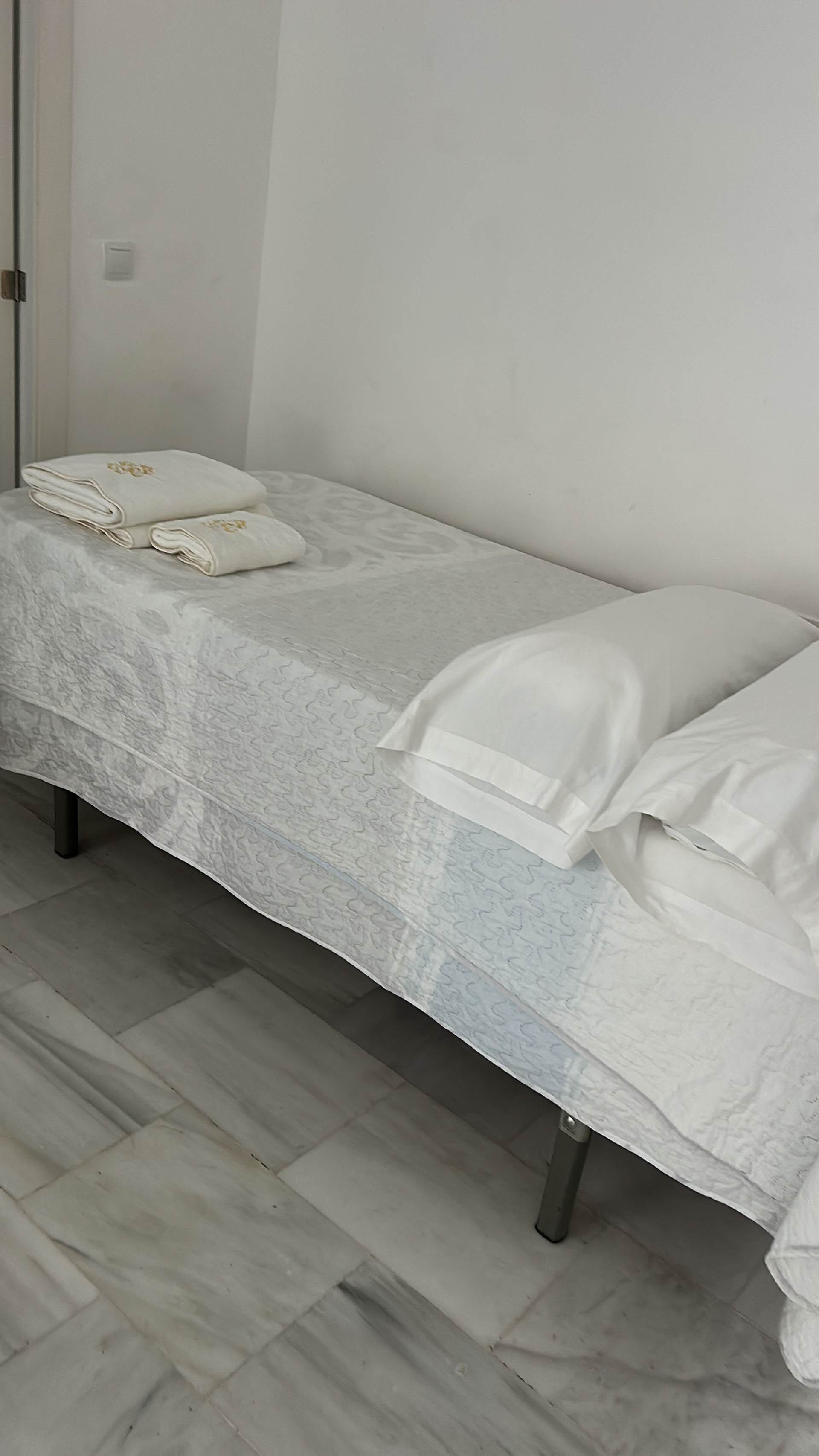 Bed with folded towels