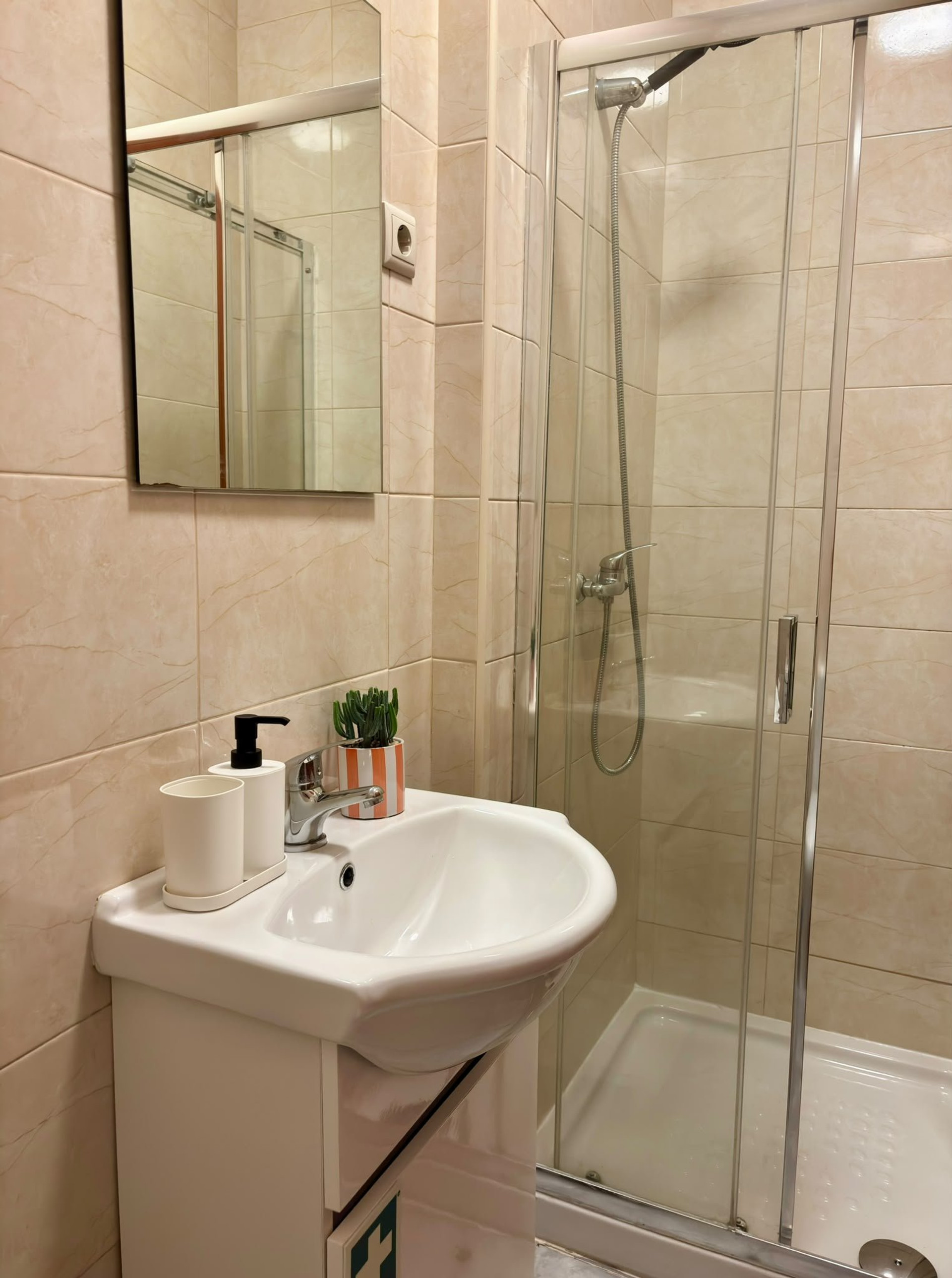 Bathroom with shower and sink