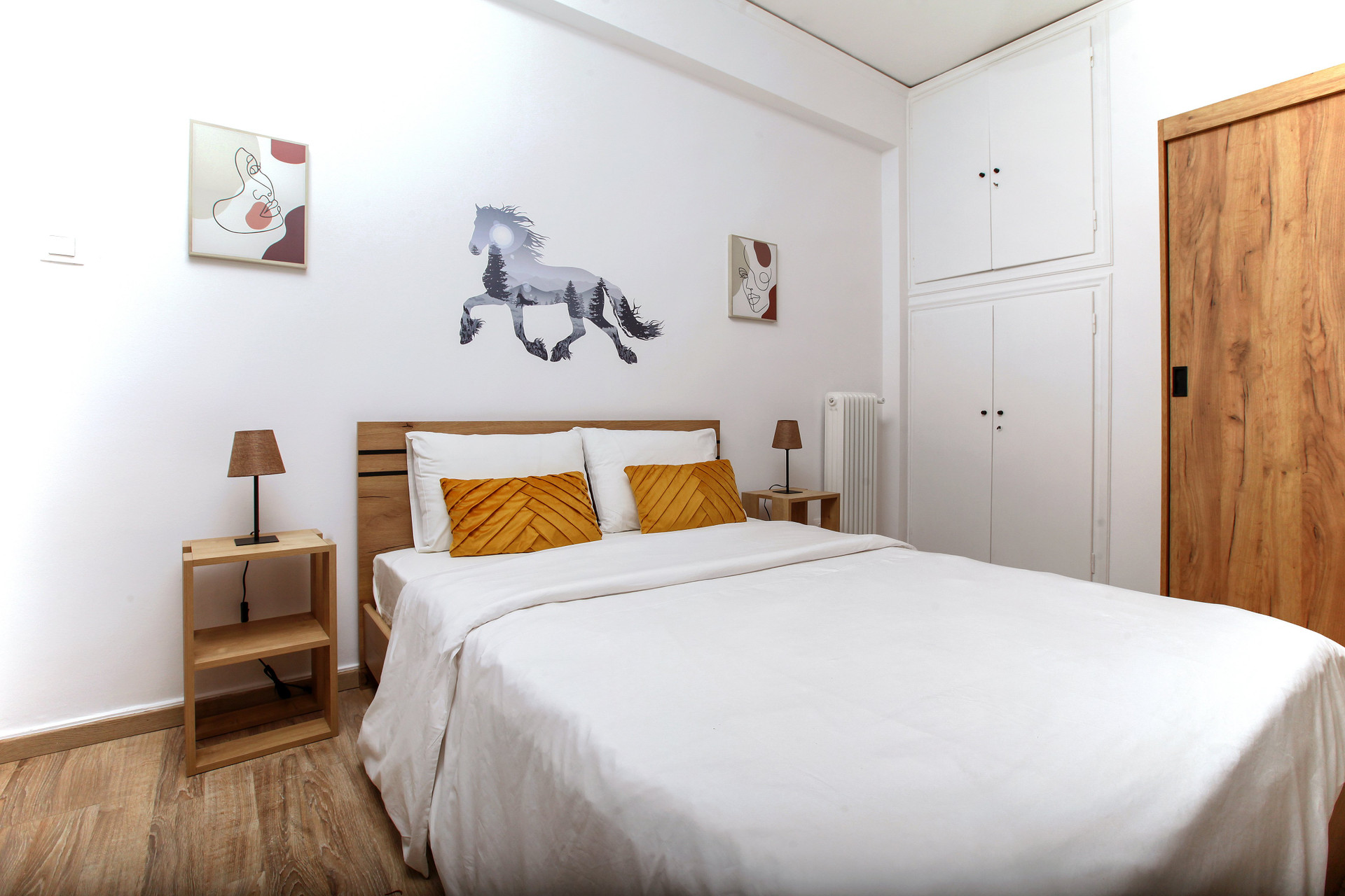 Bedroom with double bed and wardrobes