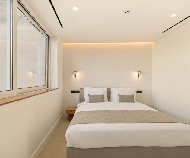 Cozy bedroom with large window