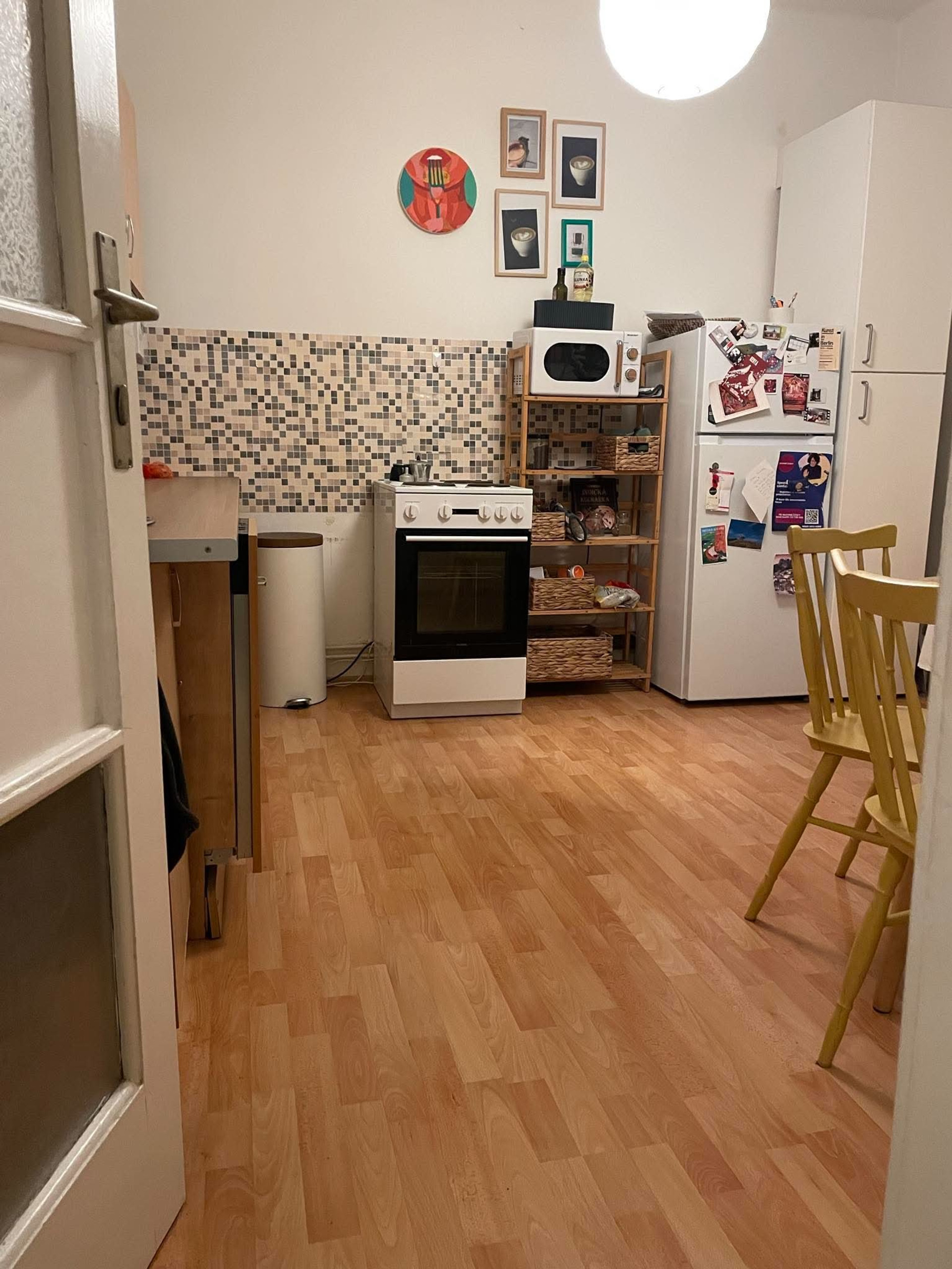Kitchen with stove and shelving