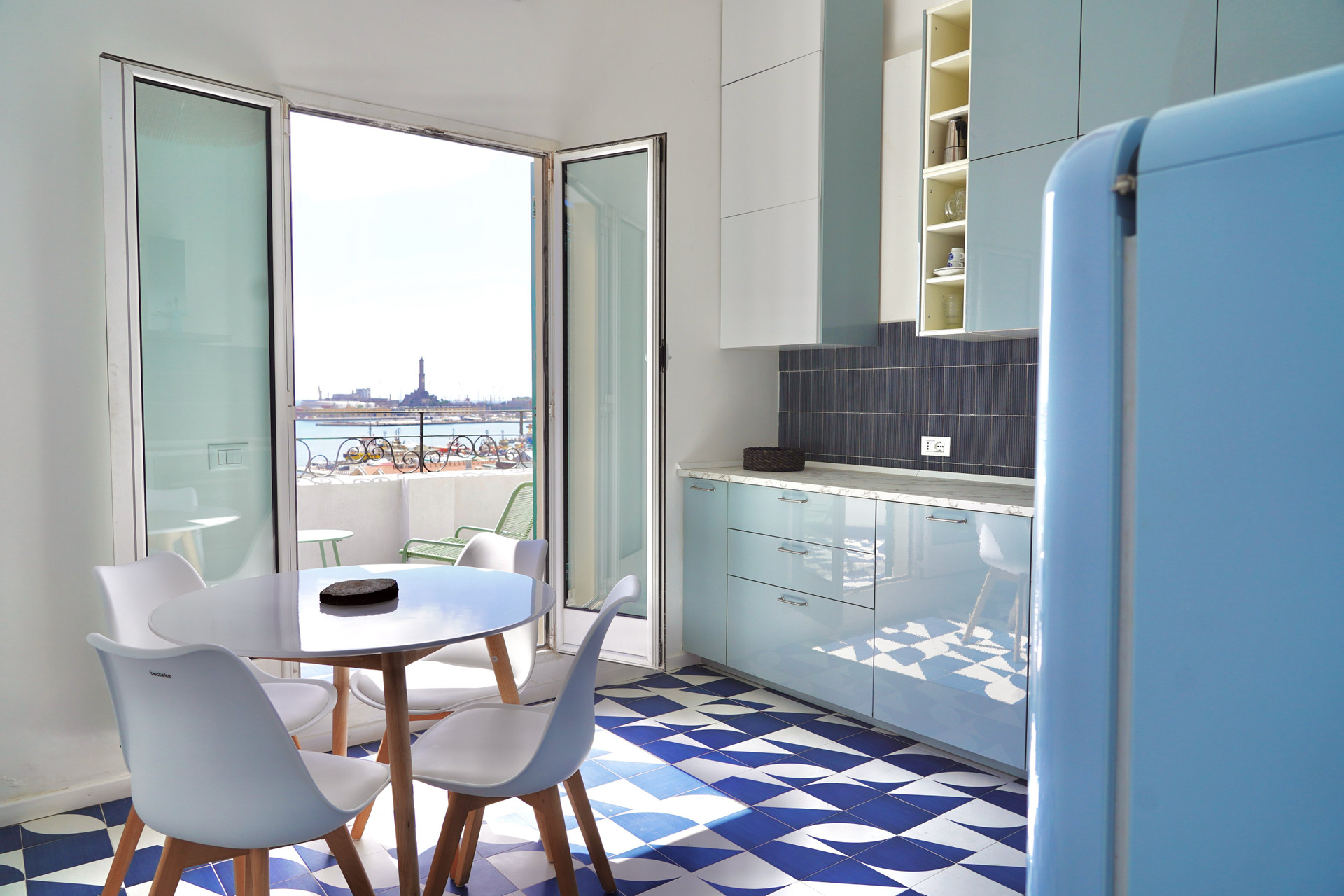 Blue kitchen with dining area