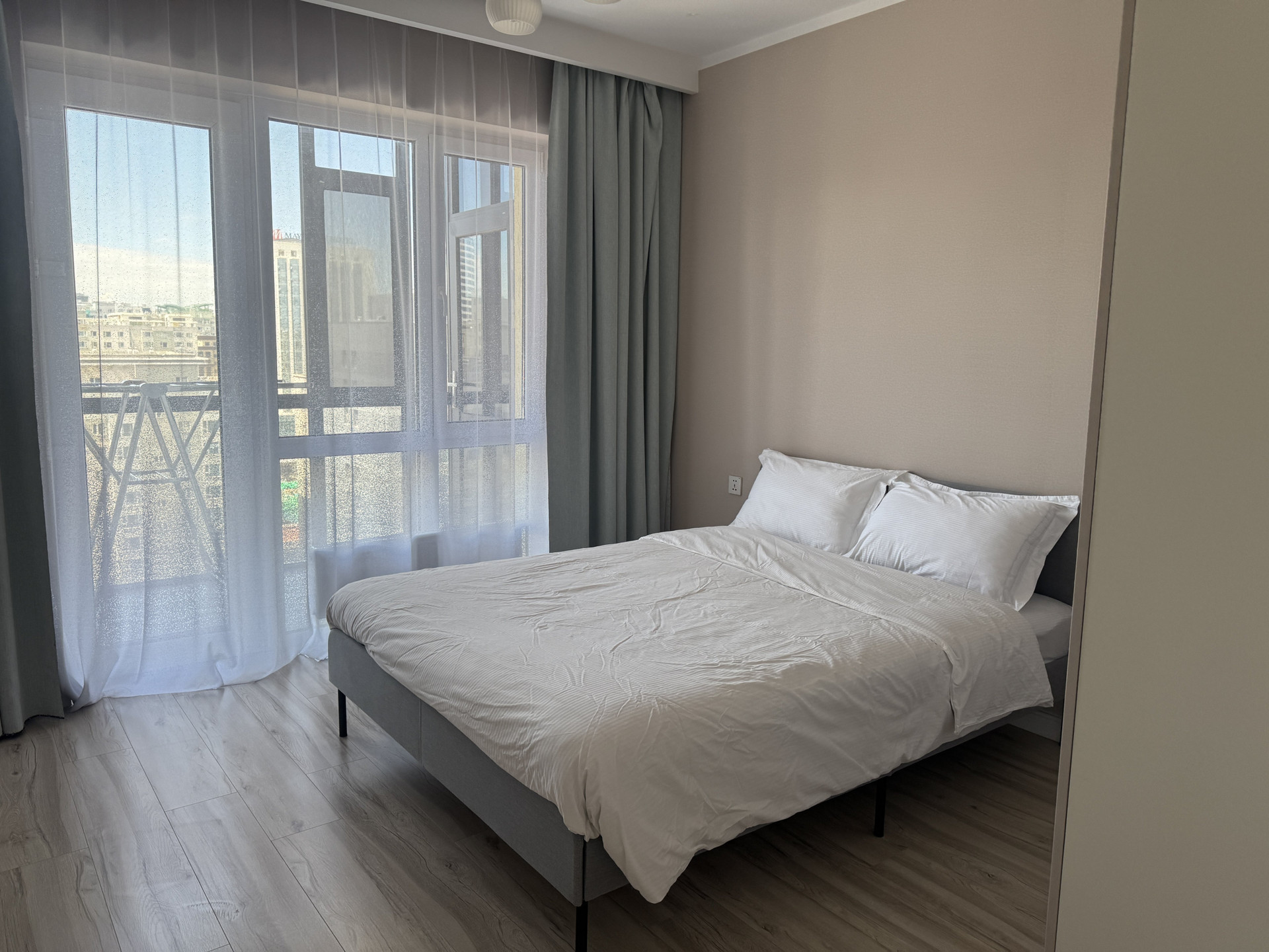 Bedroom with city view window
