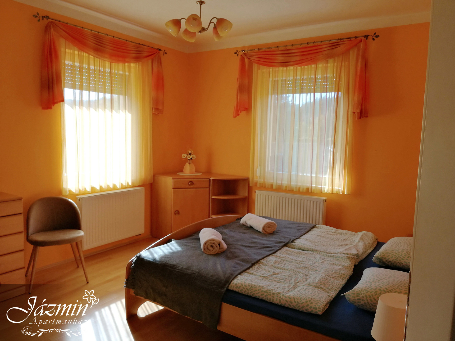 Bright orange bedroom with double bed