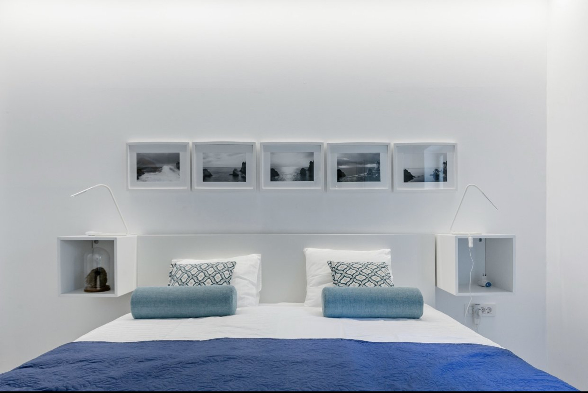 Bedroom headboard with coastal art