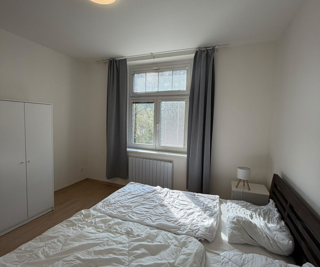Bedroom with wardrobe and bed