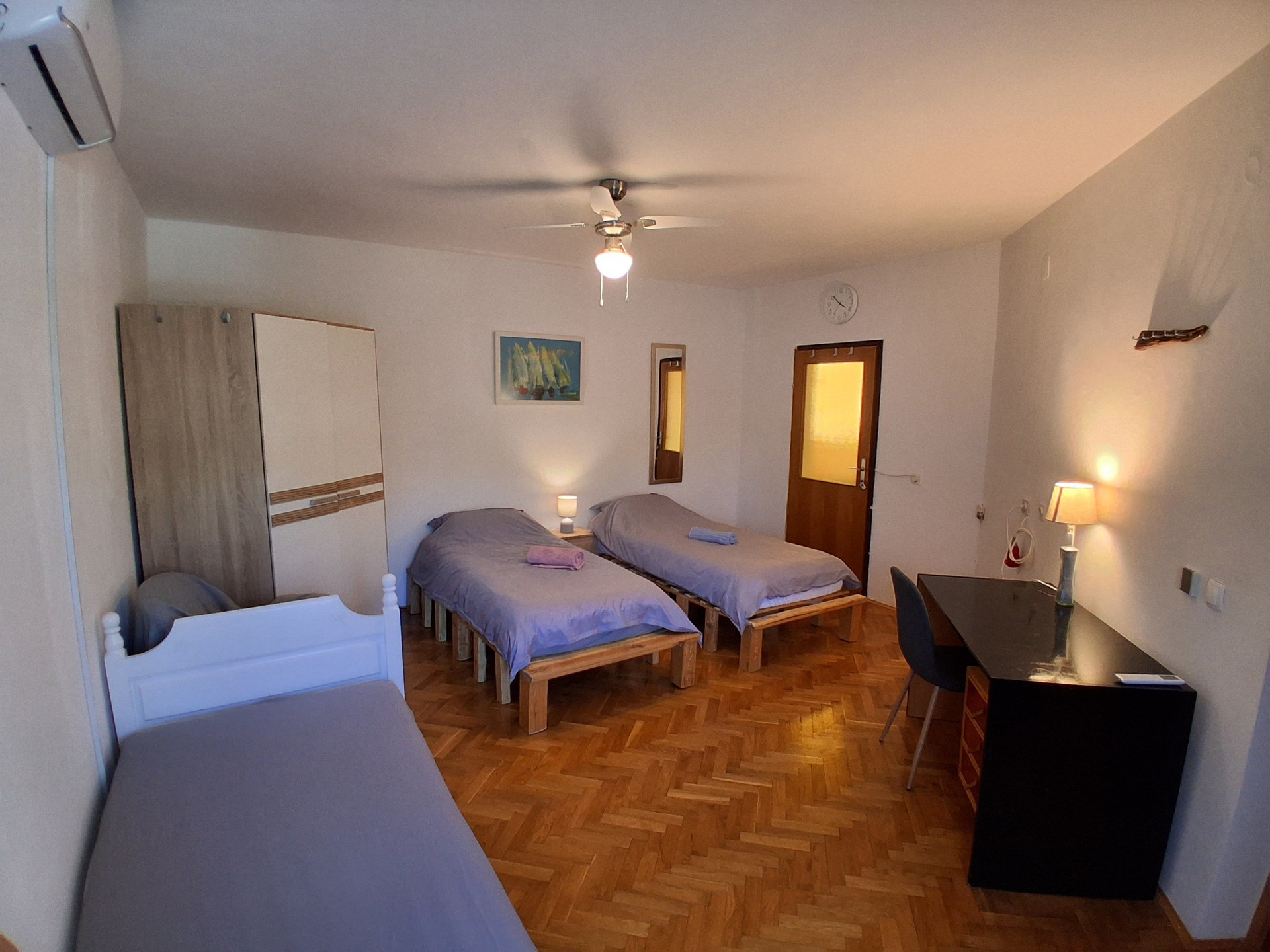 Bedroom with twin beds and desk