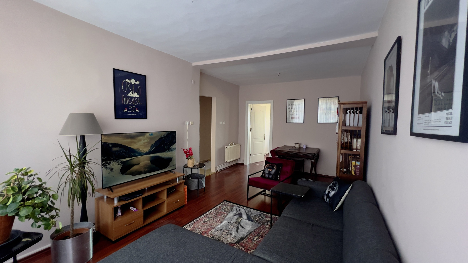 Spacious living room with TV