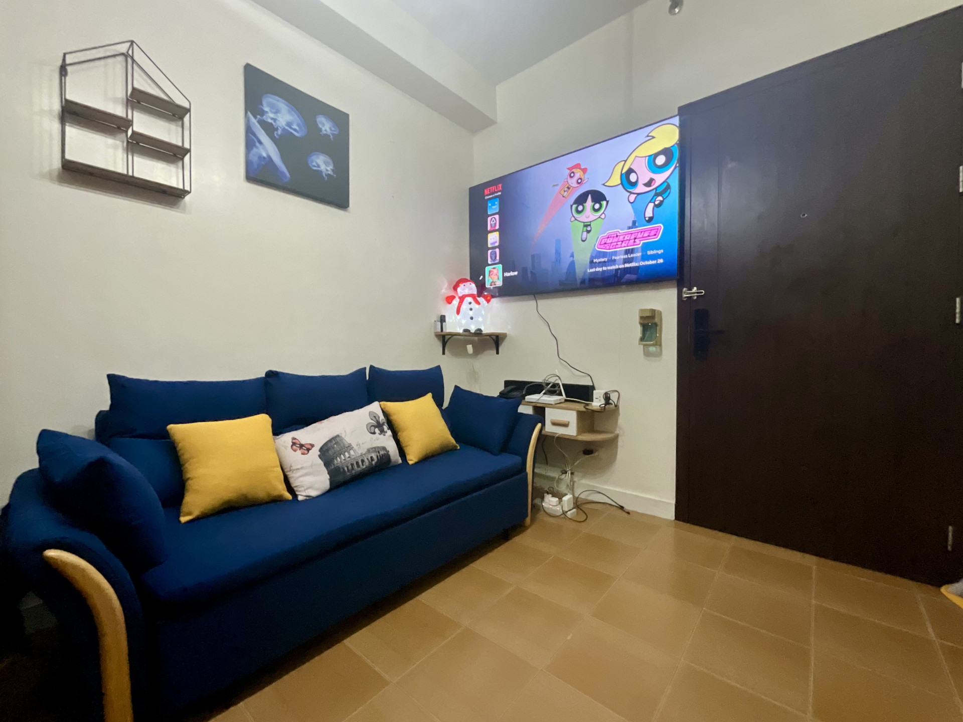 Blue sofa and Netflix smart TV