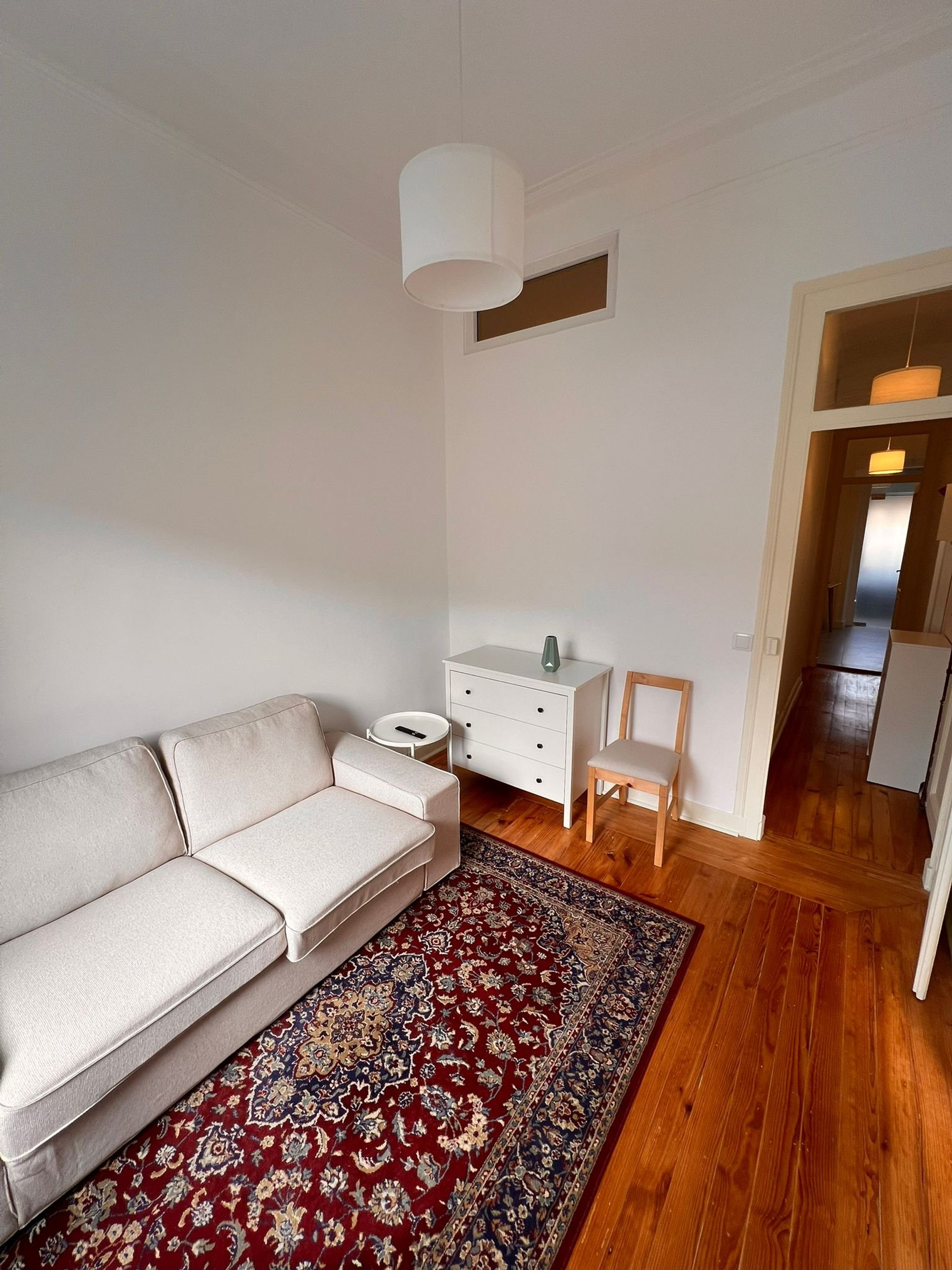 Living room sofa and hallway view