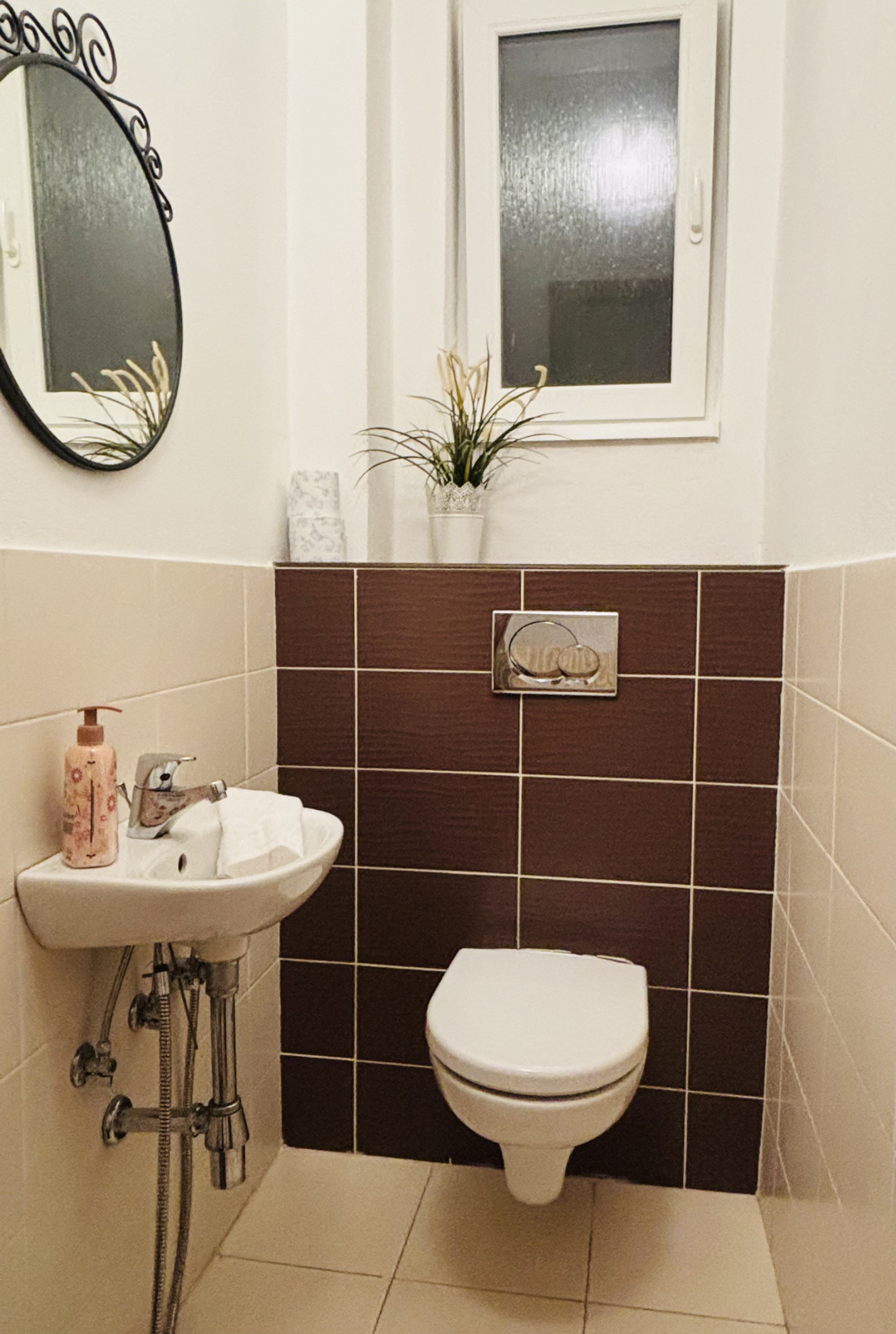 Toilette is a separate room in Slovak properties offering extra privacy and space in the main bathroom. Window for ventilation and bidet hose located under the sink.
