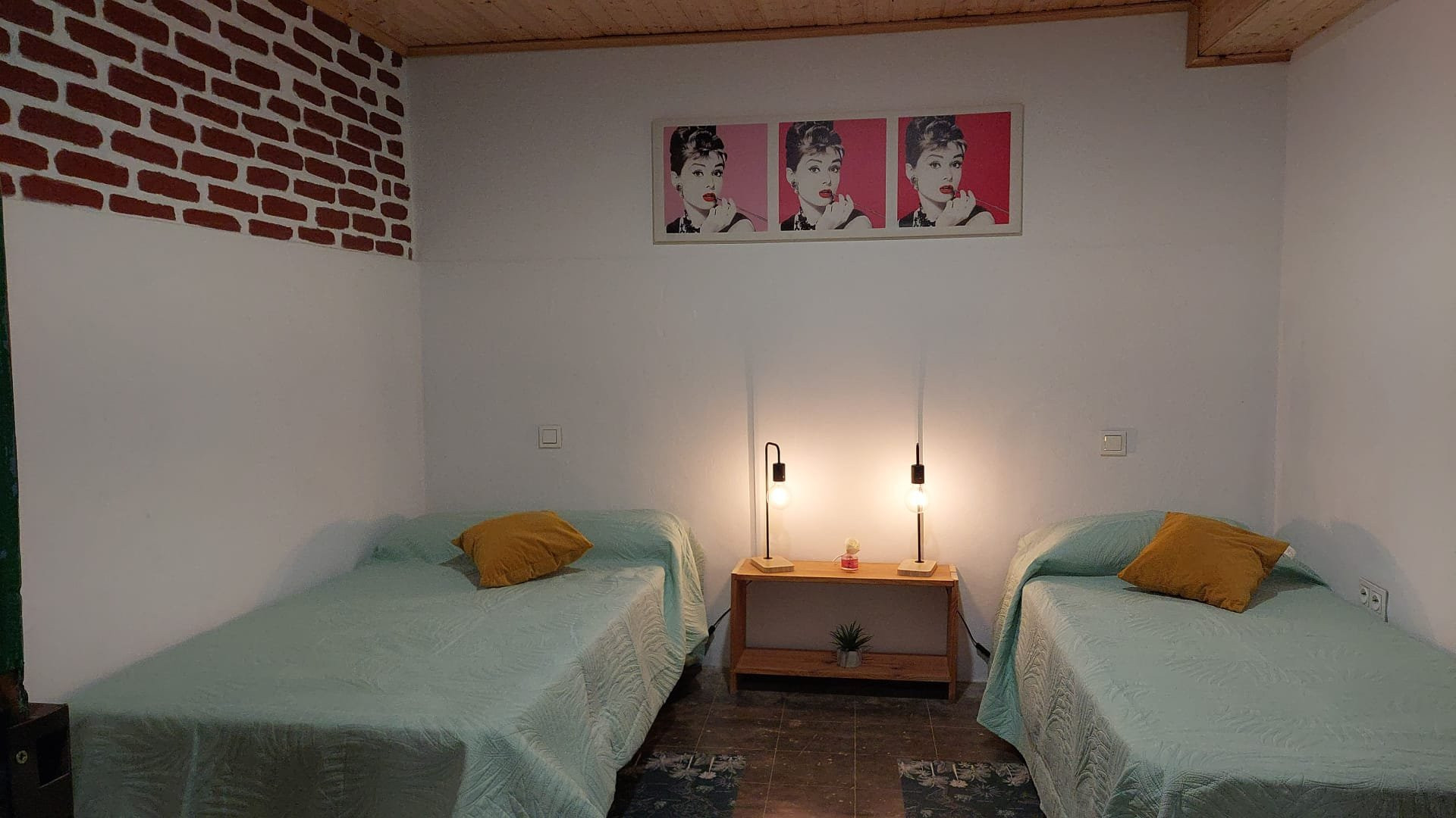 Twin bedroom with framed art