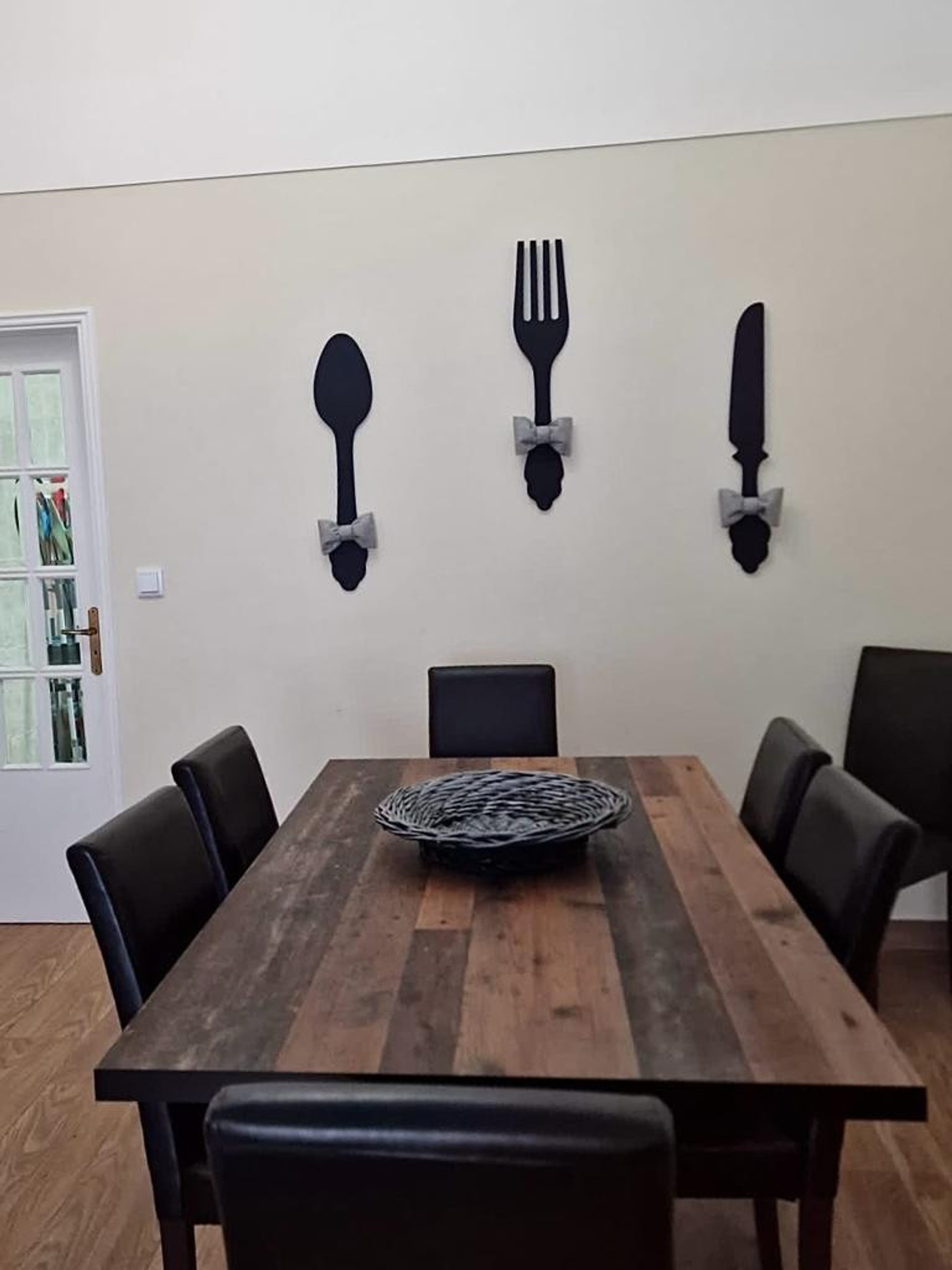Dining table with decorative cutlery