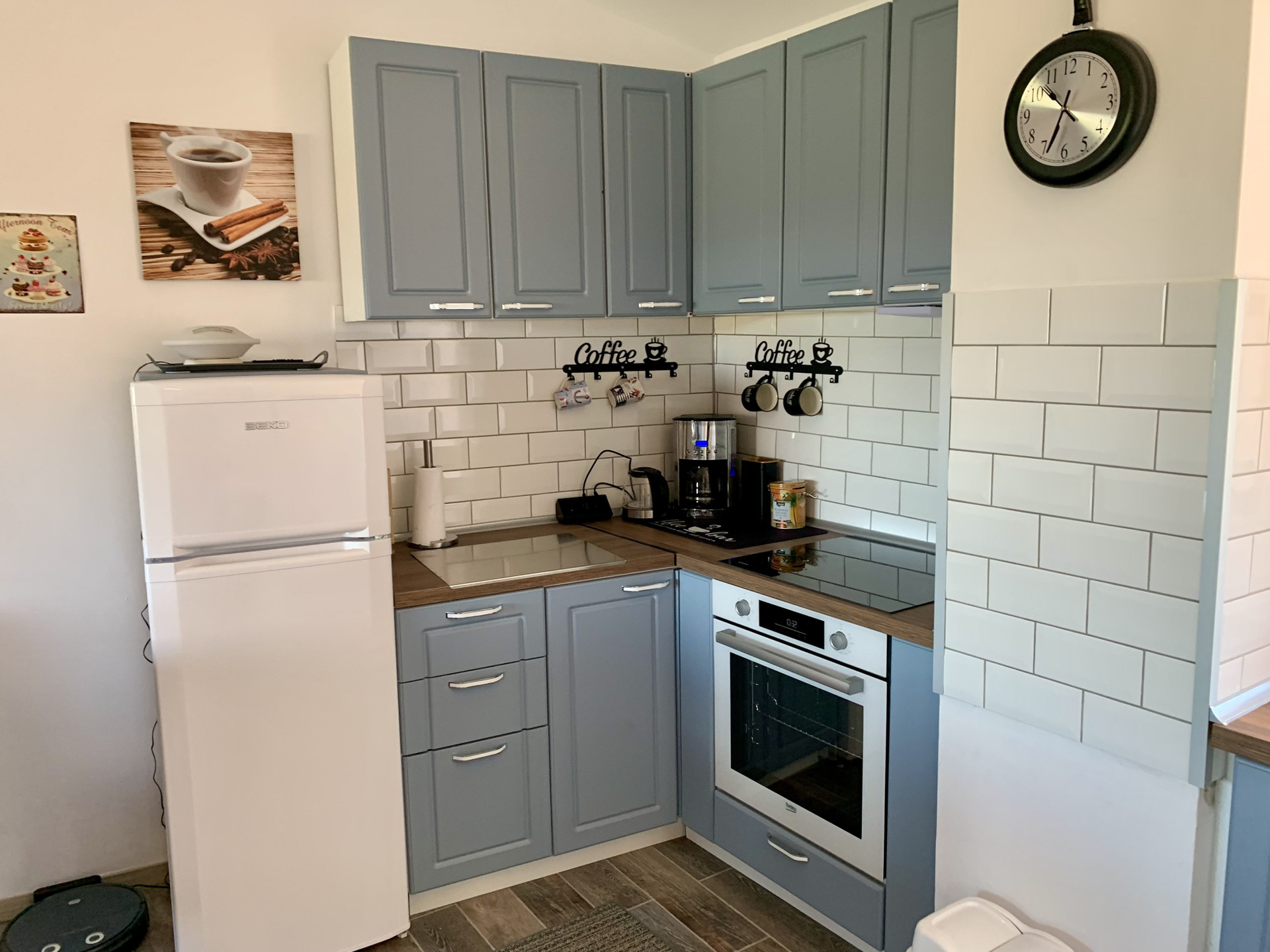 Blue kitchen cabinets with oven
