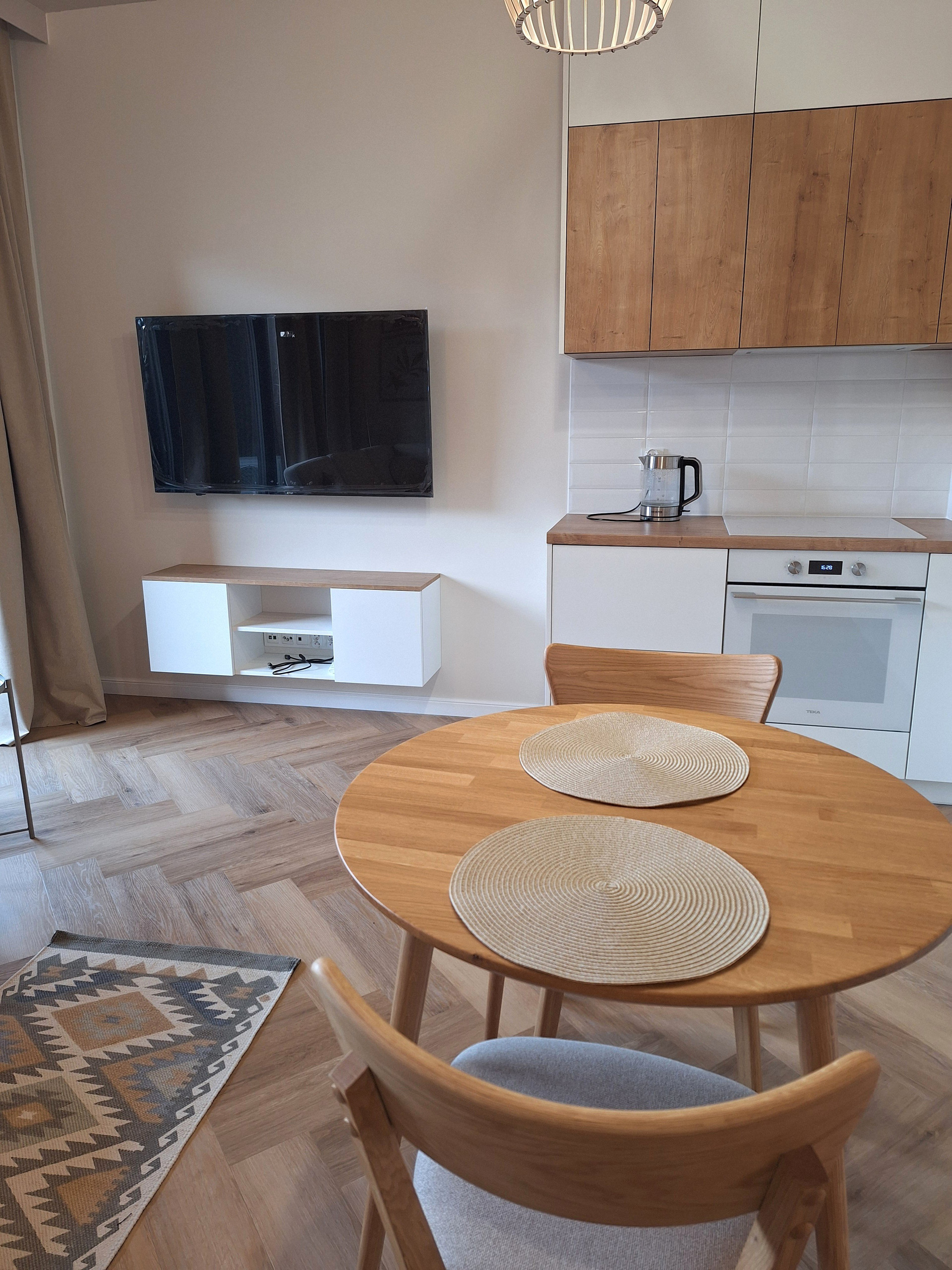 Living area with TV and kitchen